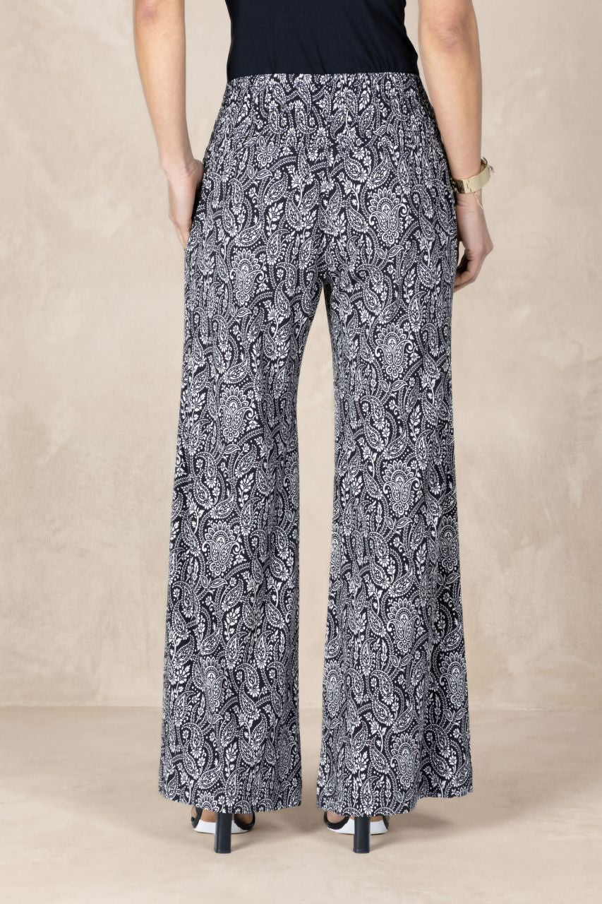 Patterned pants worn by a person on a beige background