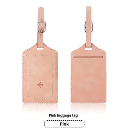 Two pink luggage tags with a visible brand logo on a white background