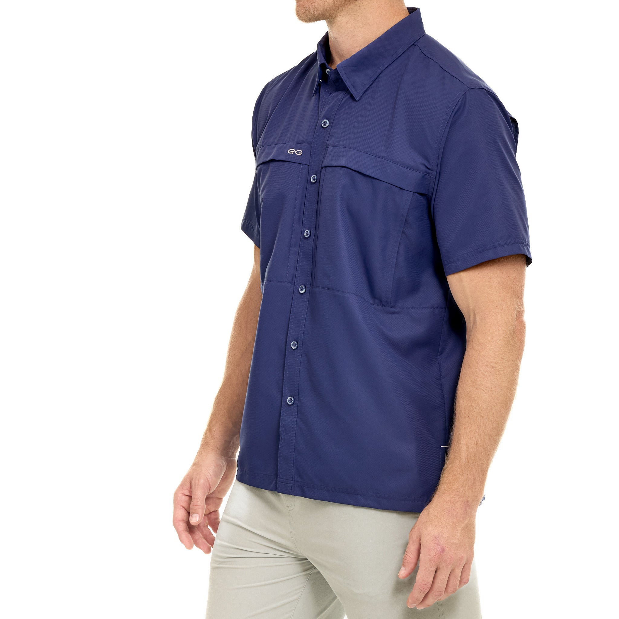 Man wearing a blue sleeveless shirt with a brand logo on a white background