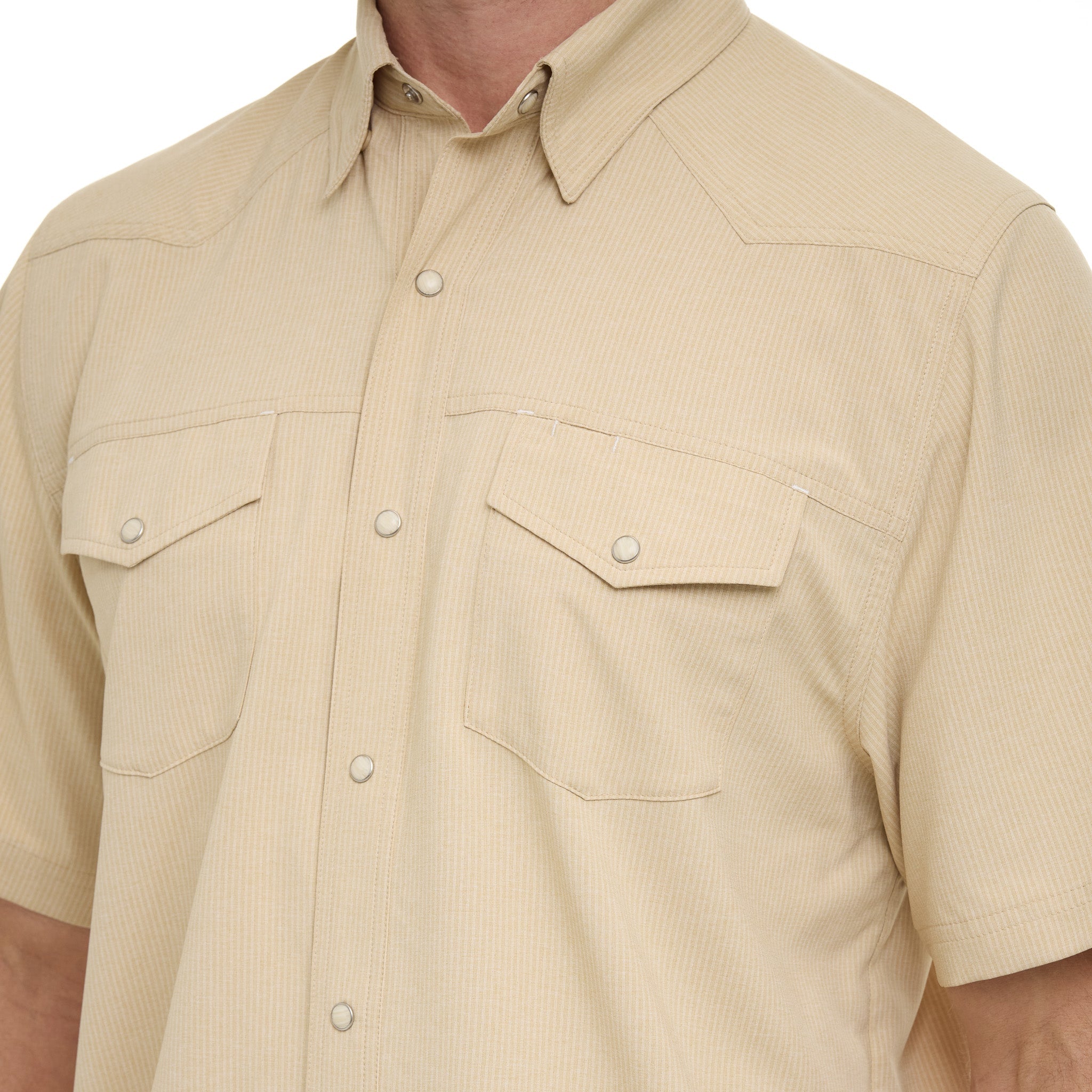 Beige short-sleeve shirt with two front pockets on a white background