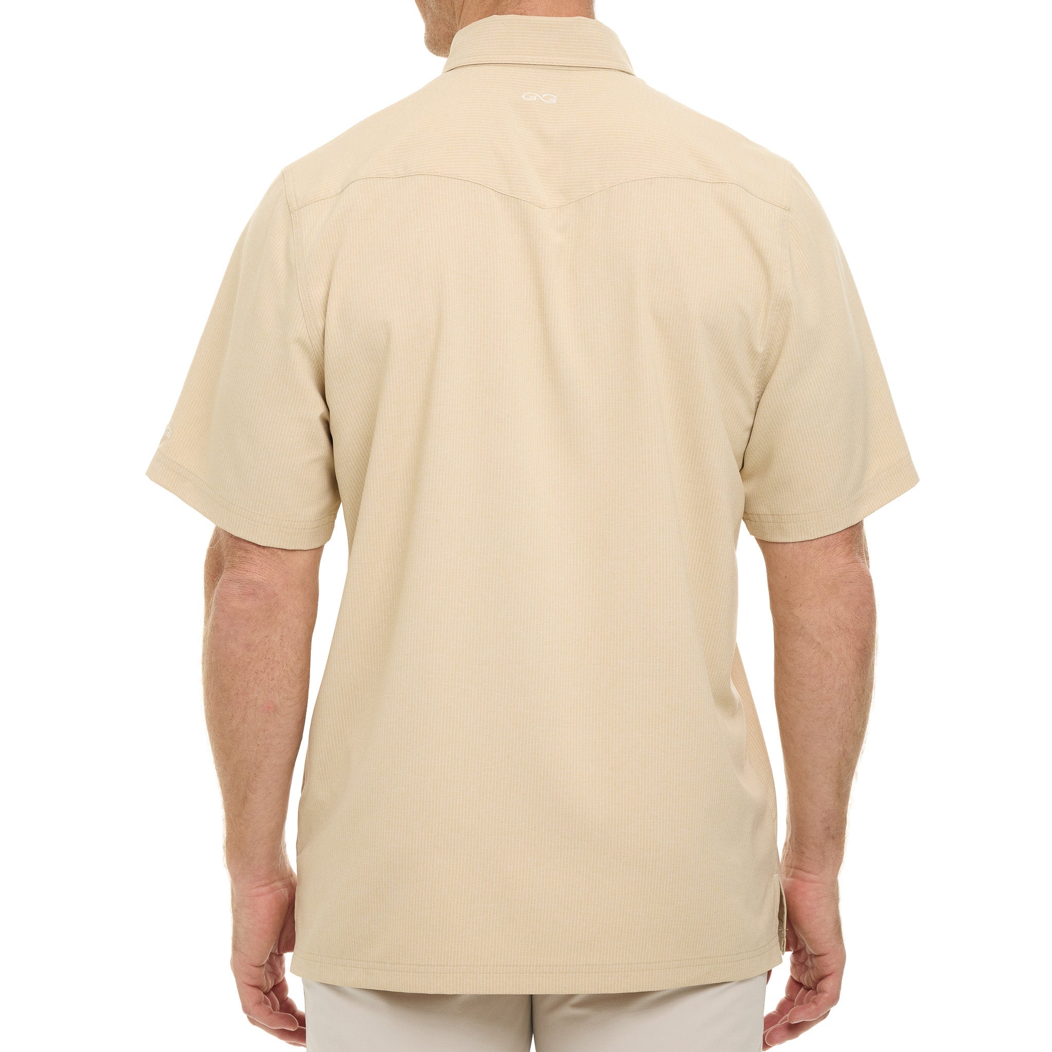 Beige polo shirt worn by a person on a white background