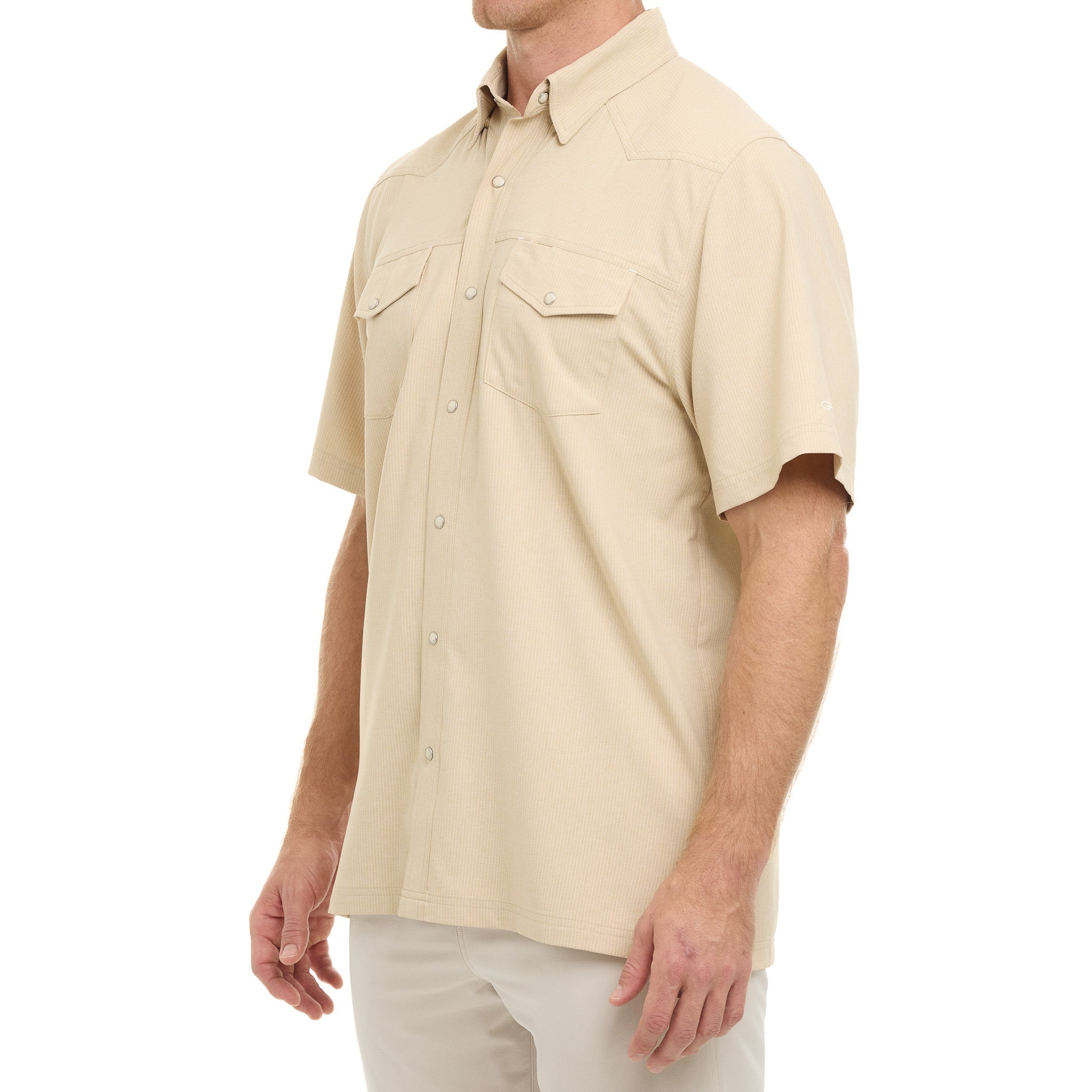 Beige short-sleeve shirt worn by a person on a white background