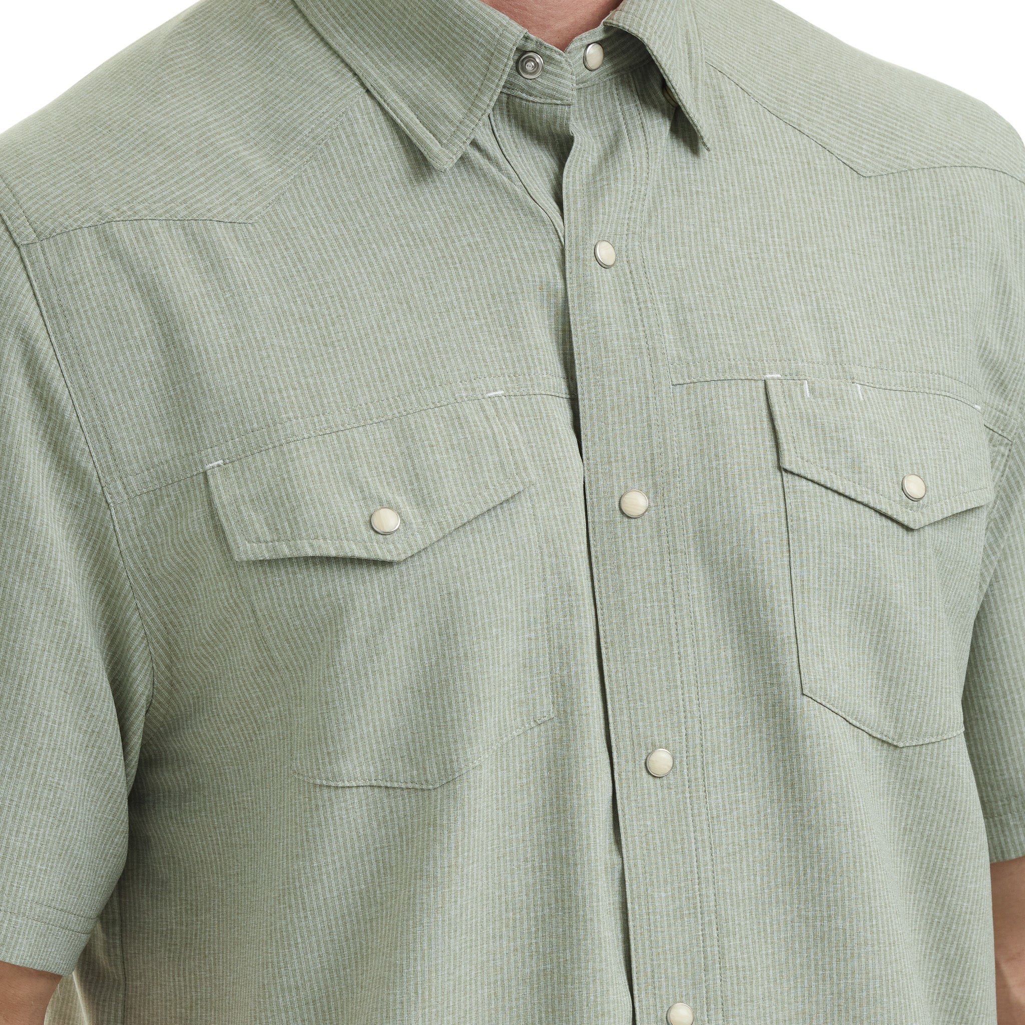 Green short-sleeve shirt with button details on a white background