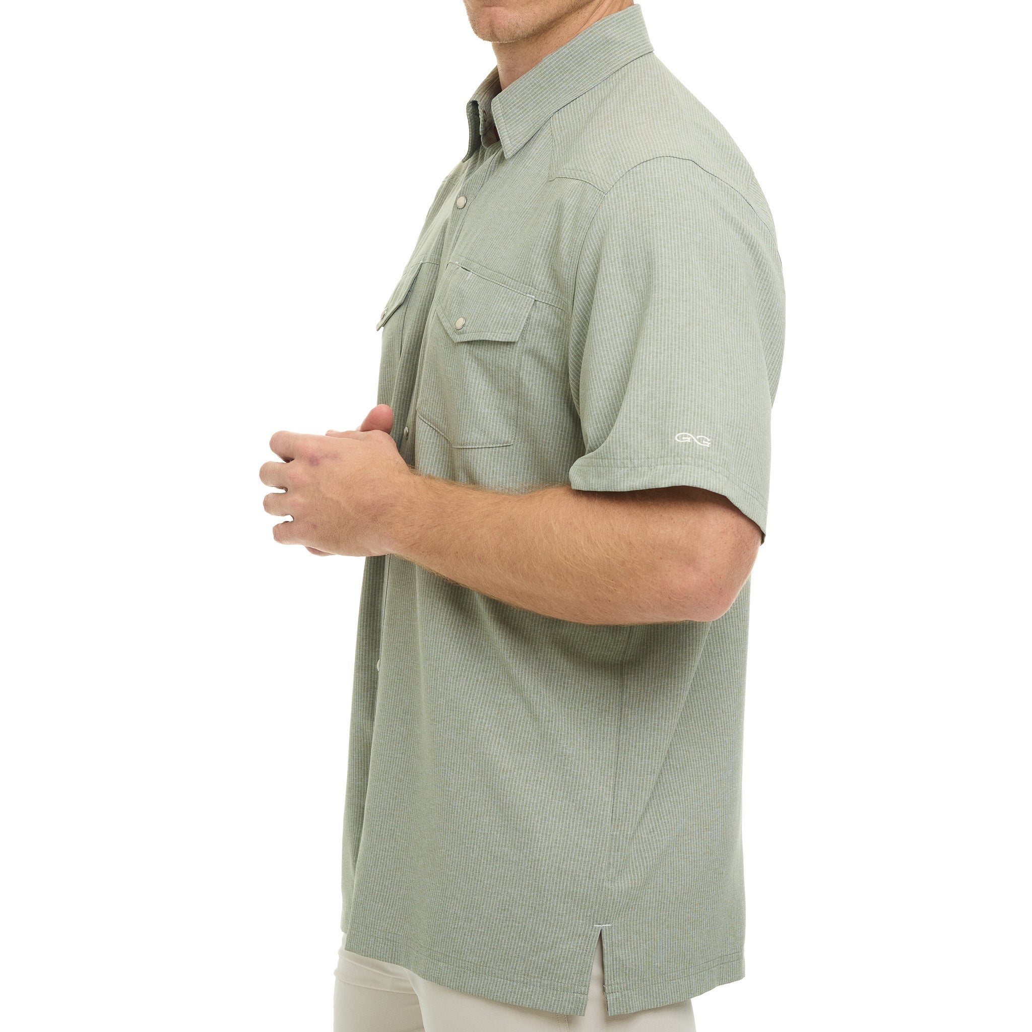 Man wearing a light green short-sleeve shirt on a white background