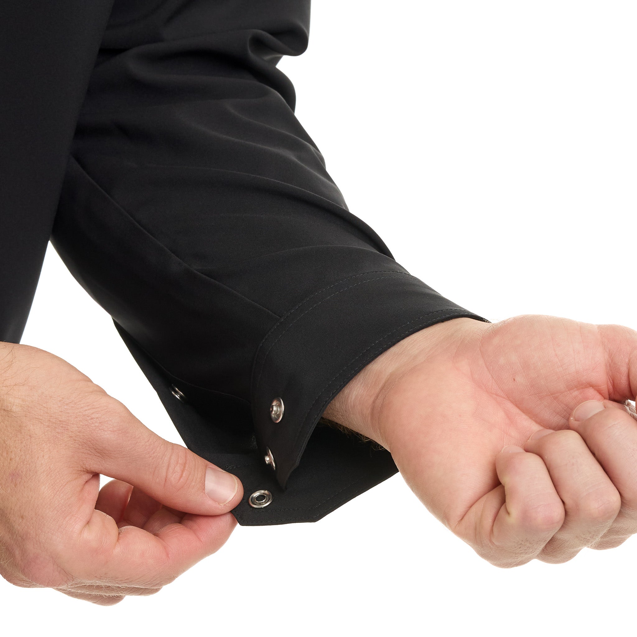 Close-up of a person adjusting the cuff of a black jacket on a white background