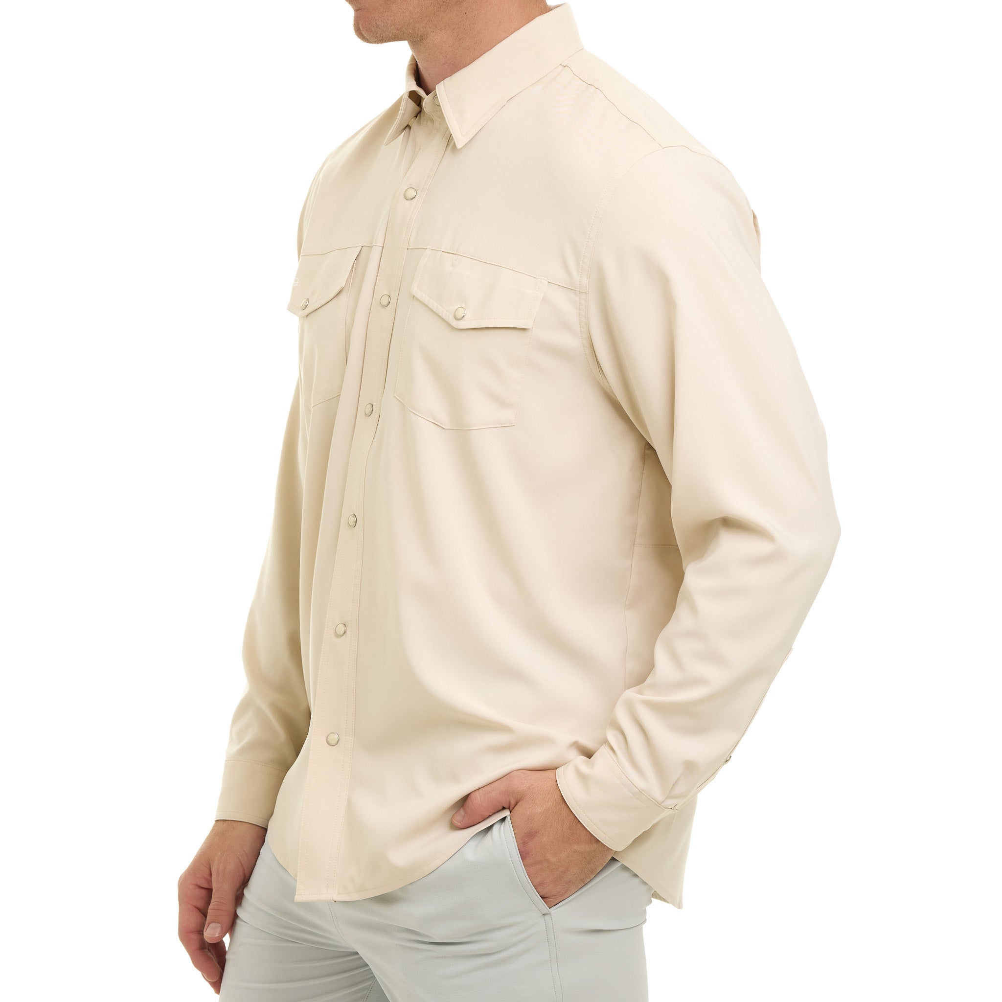Beige button-up shirt worn by a person on a white background