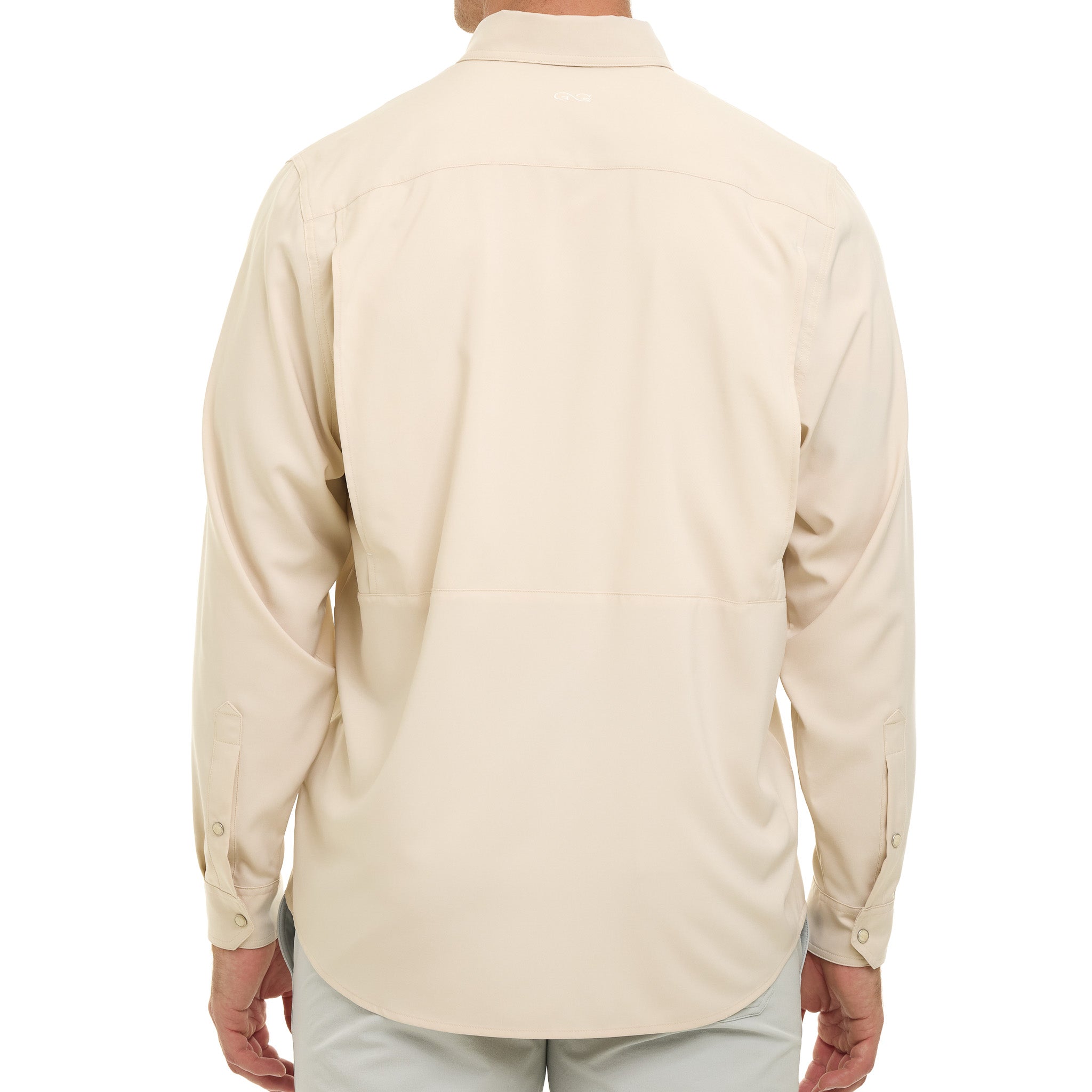 Beige button-up shirt worn by a person on a white background