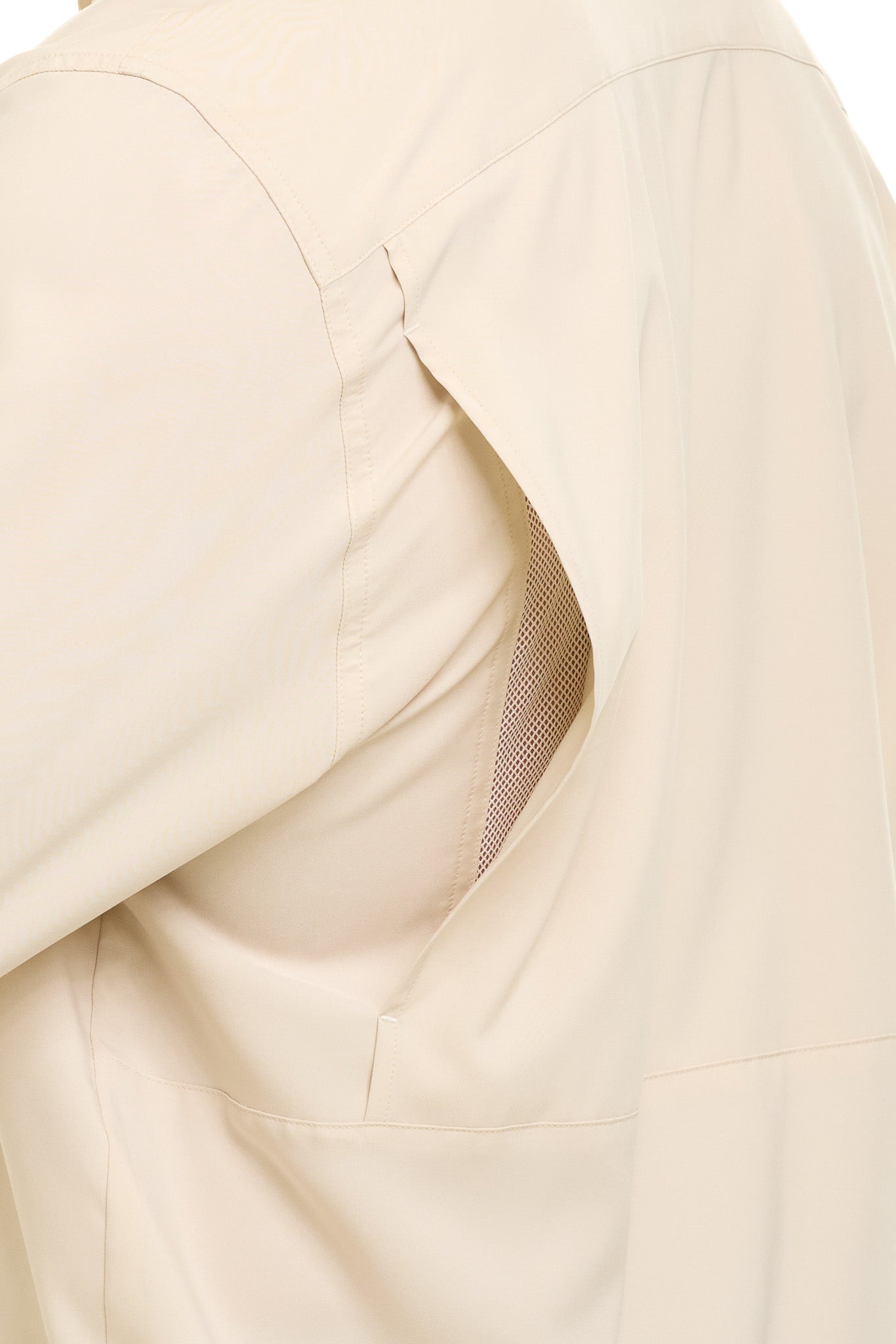Close-up of a beige fabric texture with a subtle pattern