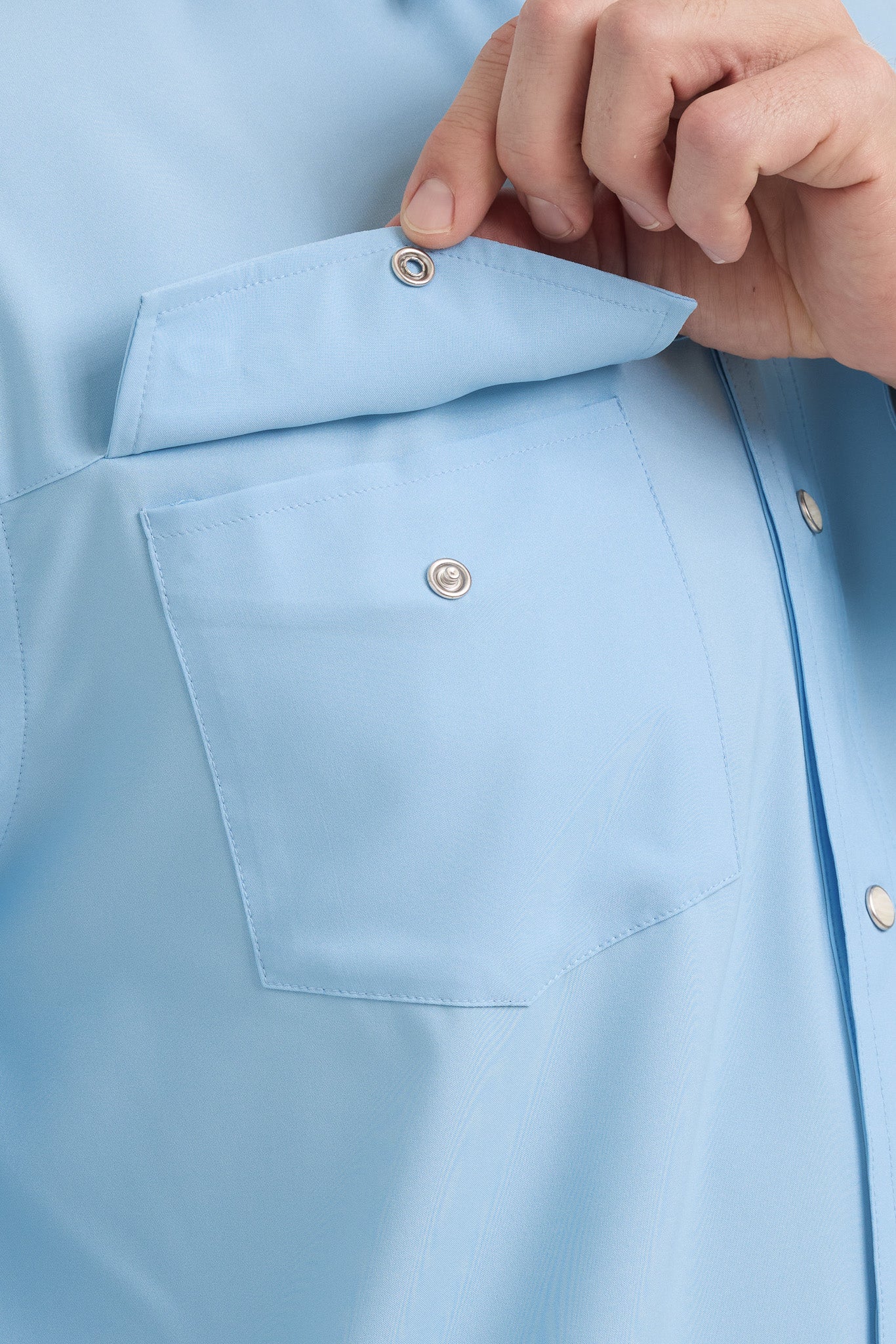 Light blue shirt with a hand adjusting the collar