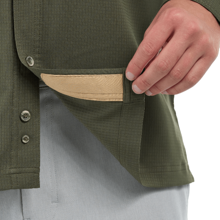 Close-up of a person wearing a green jacket with a beige patch on a white background