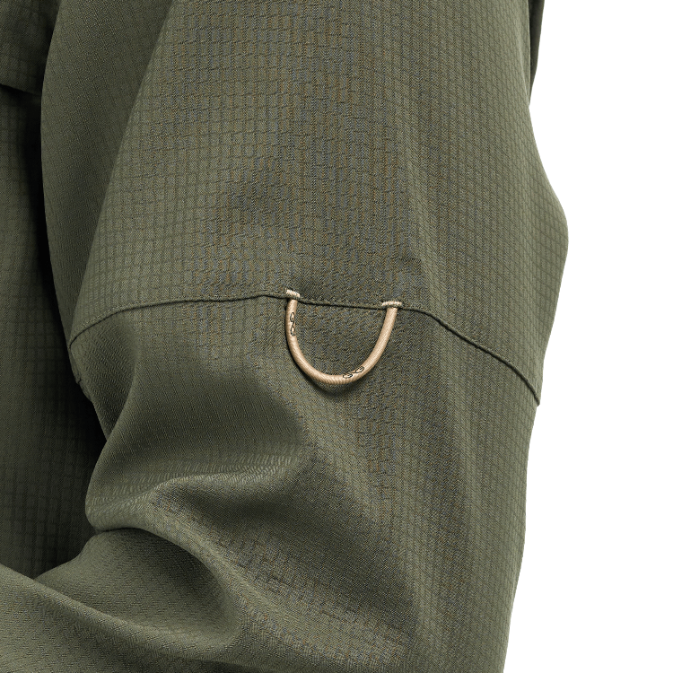 Close-up of a green checkered suit with a brass button on a white background