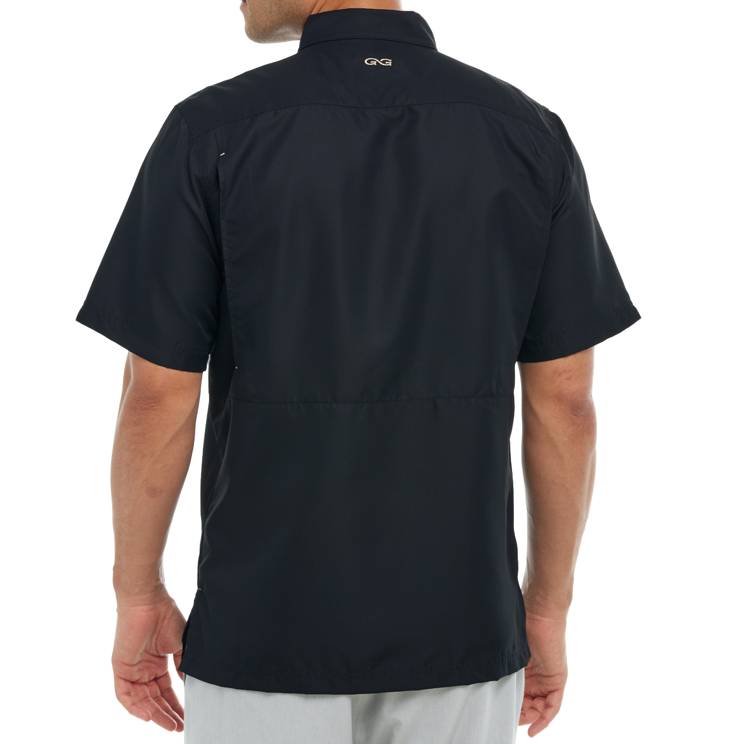 Black short-sleeve shirt worn by a person on a white background