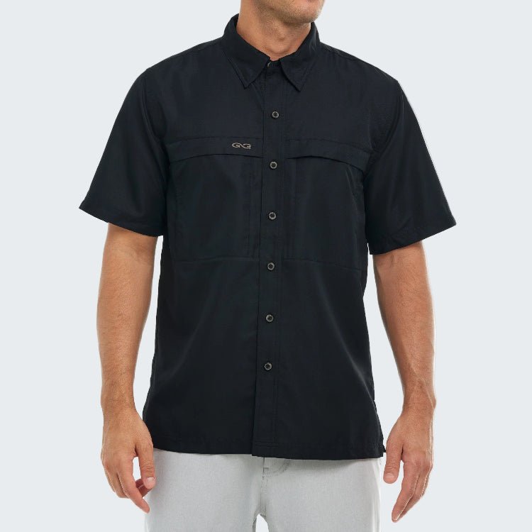 Black short-sleeve shirt with button details on a white background