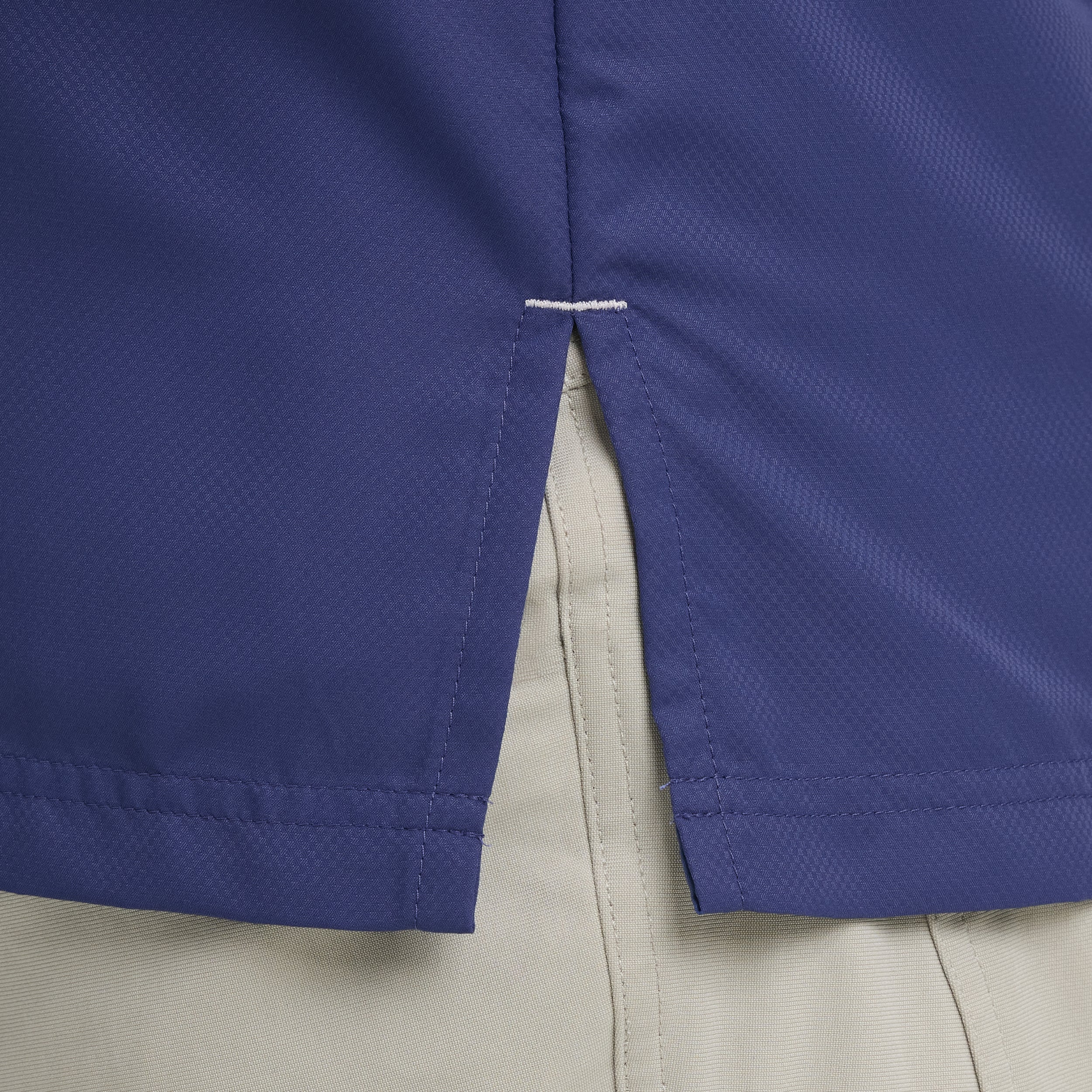 Close-up of a blue and beige jacket corner