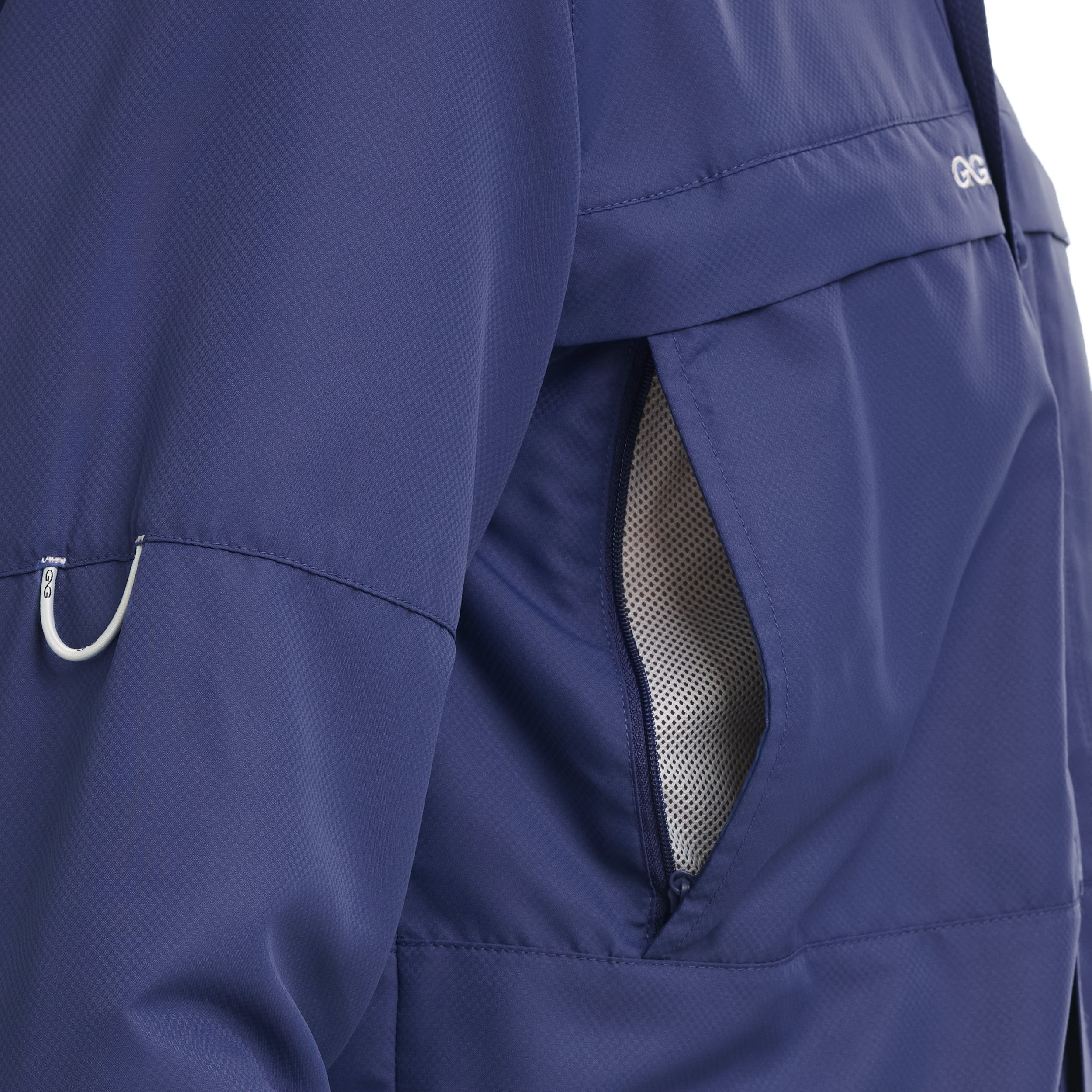 Close-up of a blue jacket with a mesh pocket and visible brand logo.