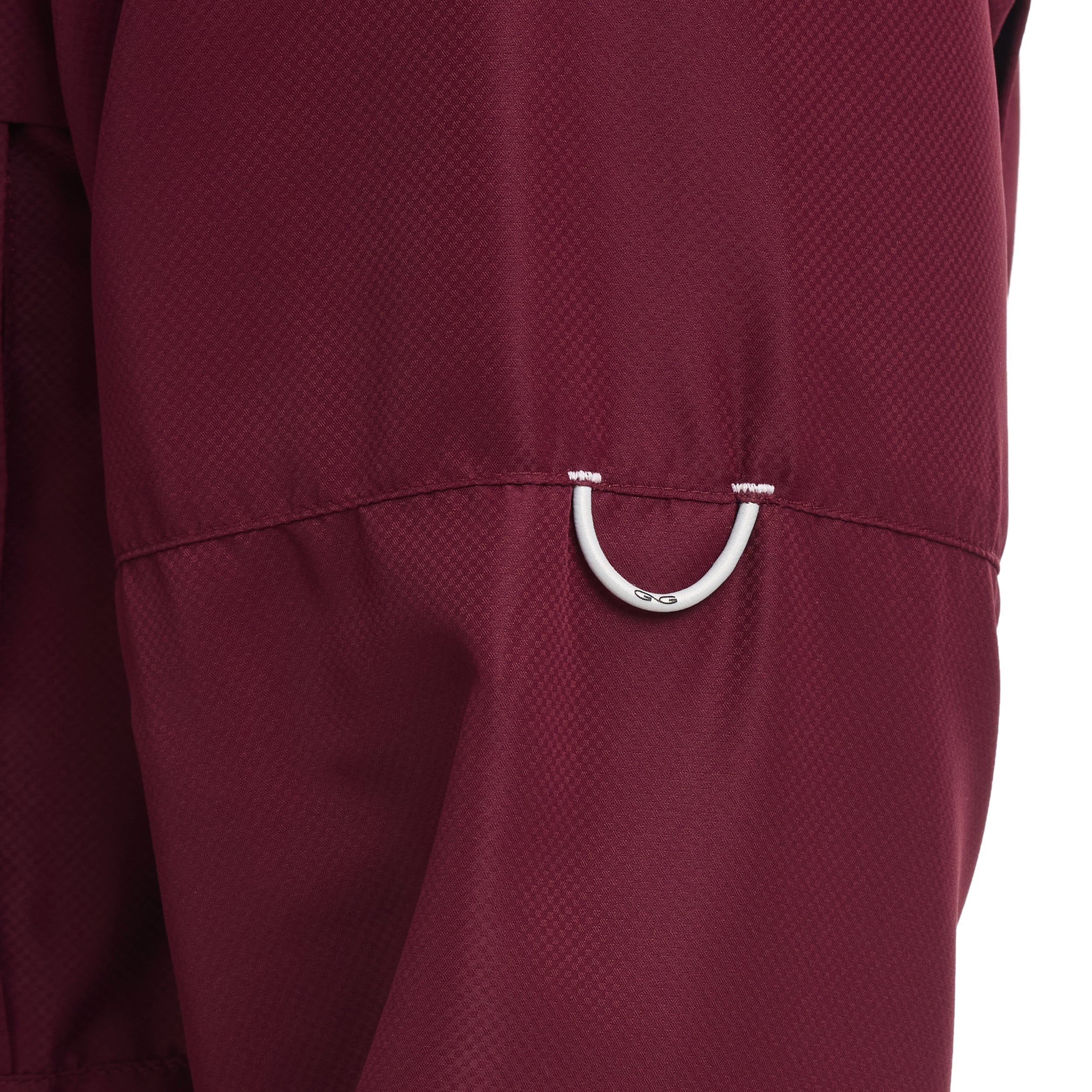Close-up of a maroon bag with a silver buckle on a white background