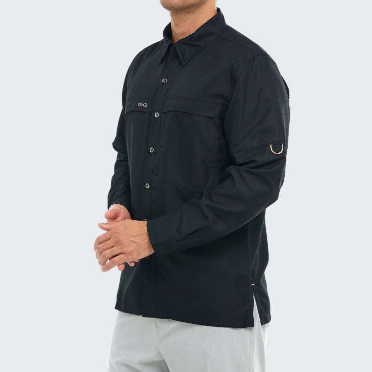 Person wearing a dark blue shirt with a brand logo on a white background