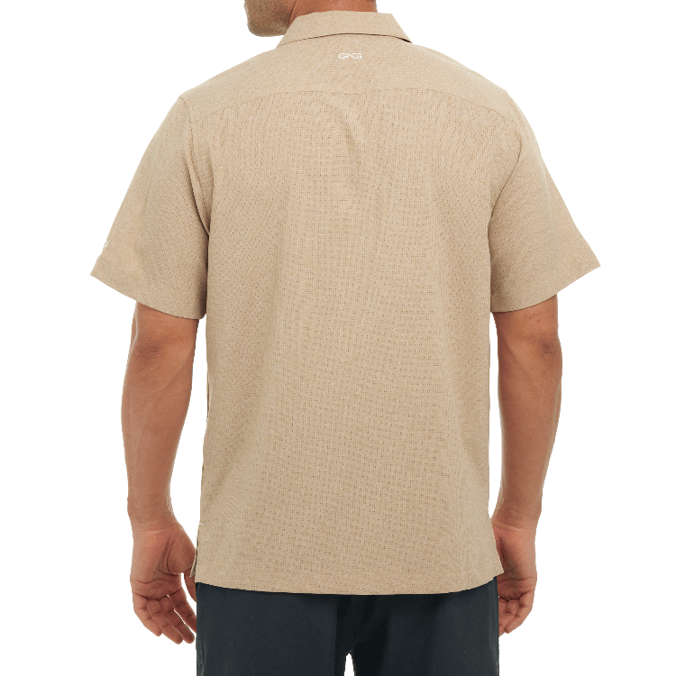 Beige polo shirt worn by a person on a white background