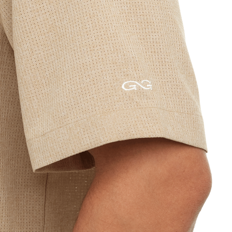 Beige shorts with a logo on a white background