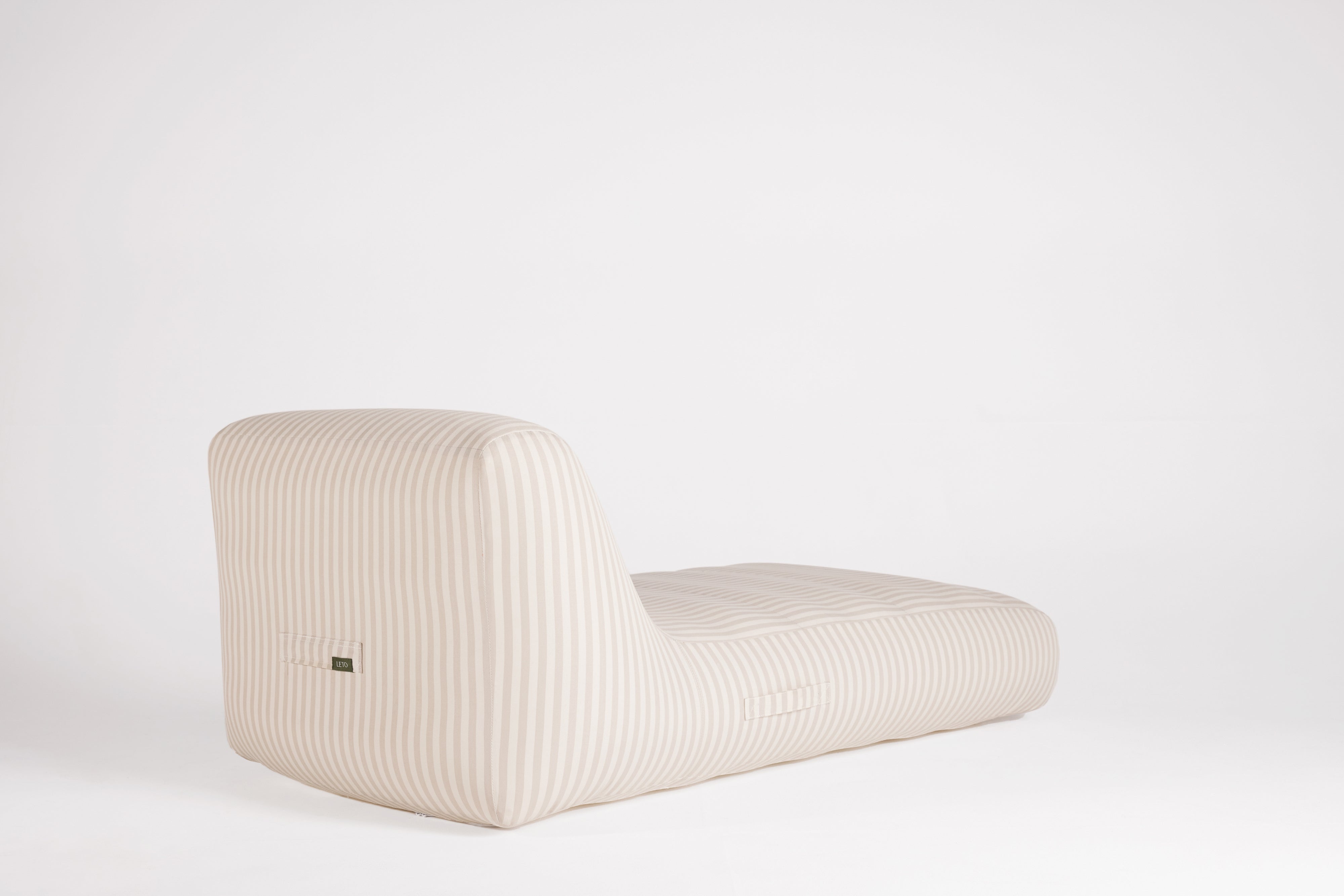 Modern white sofa on a light gray background