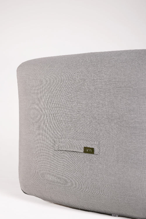 Gray fabric surface with a brand label on a white background