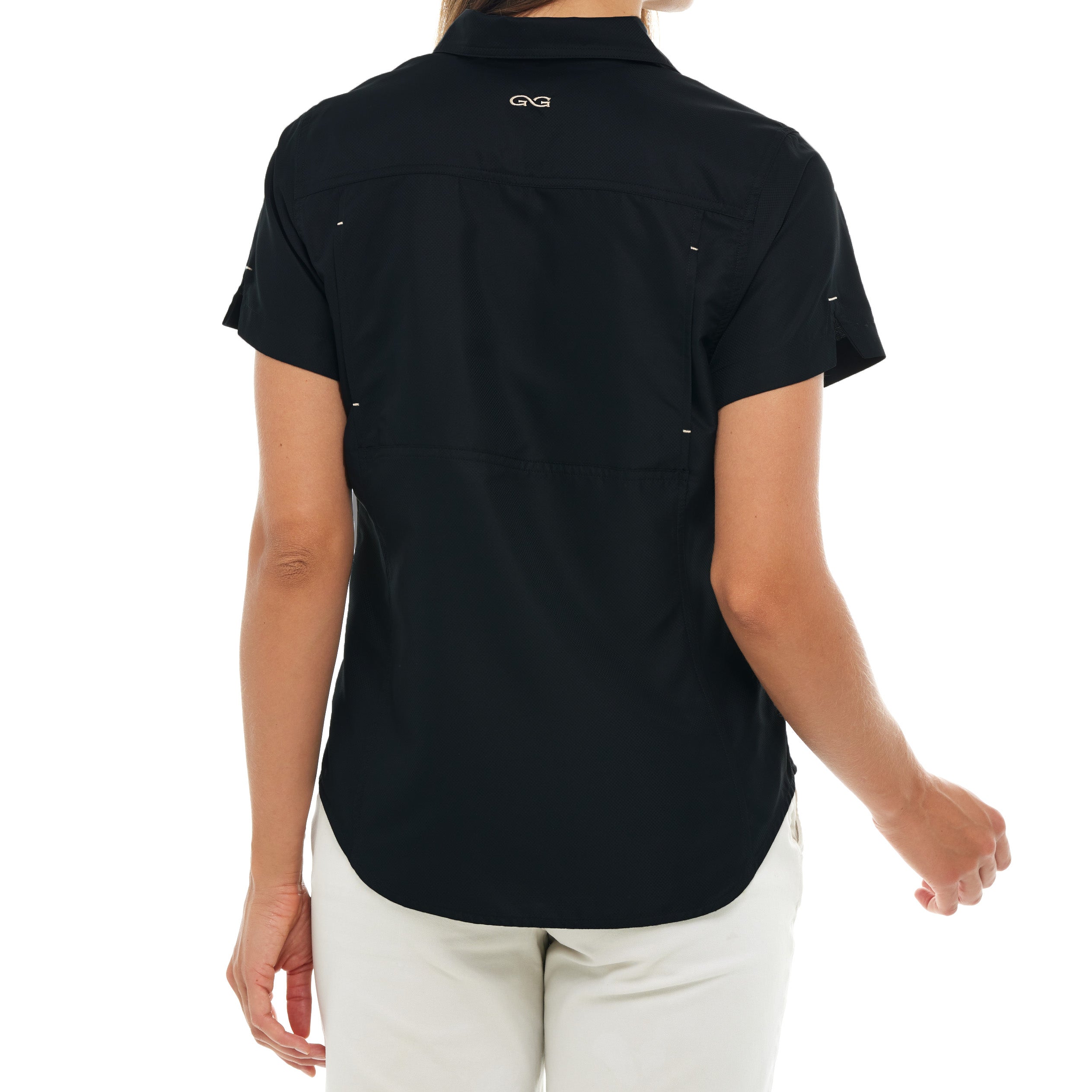 Person wearing a black short-sleeve shirt with a logo on the back, standing against a white background.