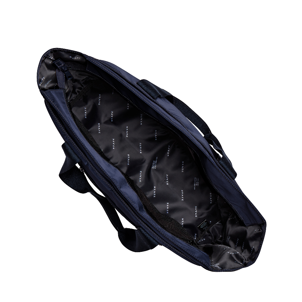 Navy blue sports bag with black interior on a white background