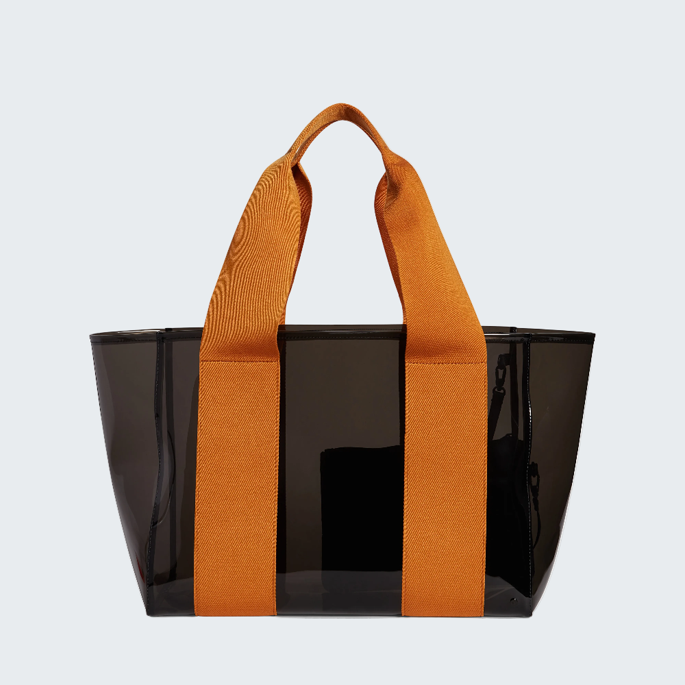 Black tote bag with orange handles on a white background