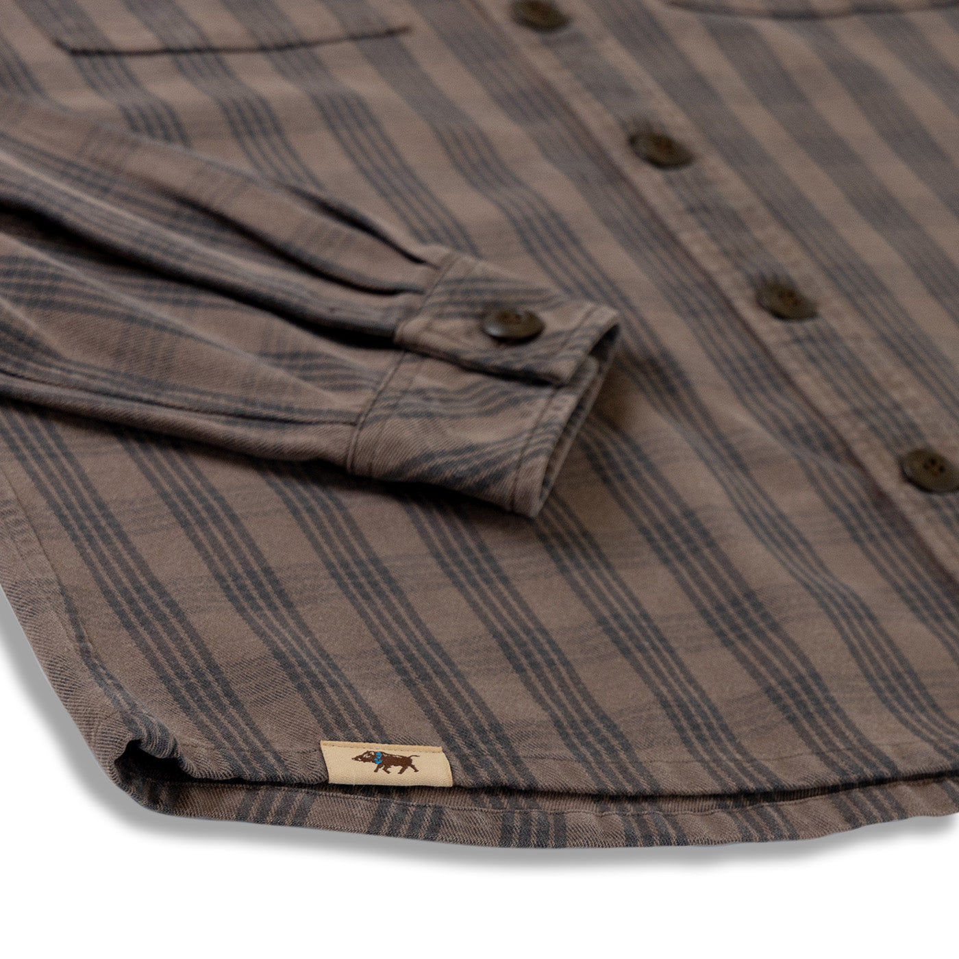 Brown and gray striped shirt with a brand label on a white background
