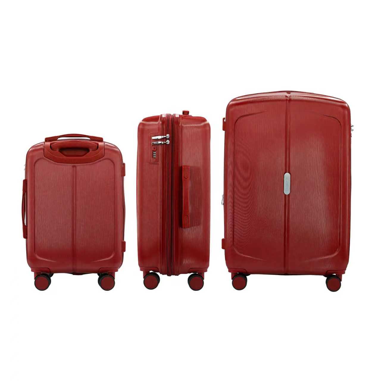 Three red suitcases of different sizes on a white background