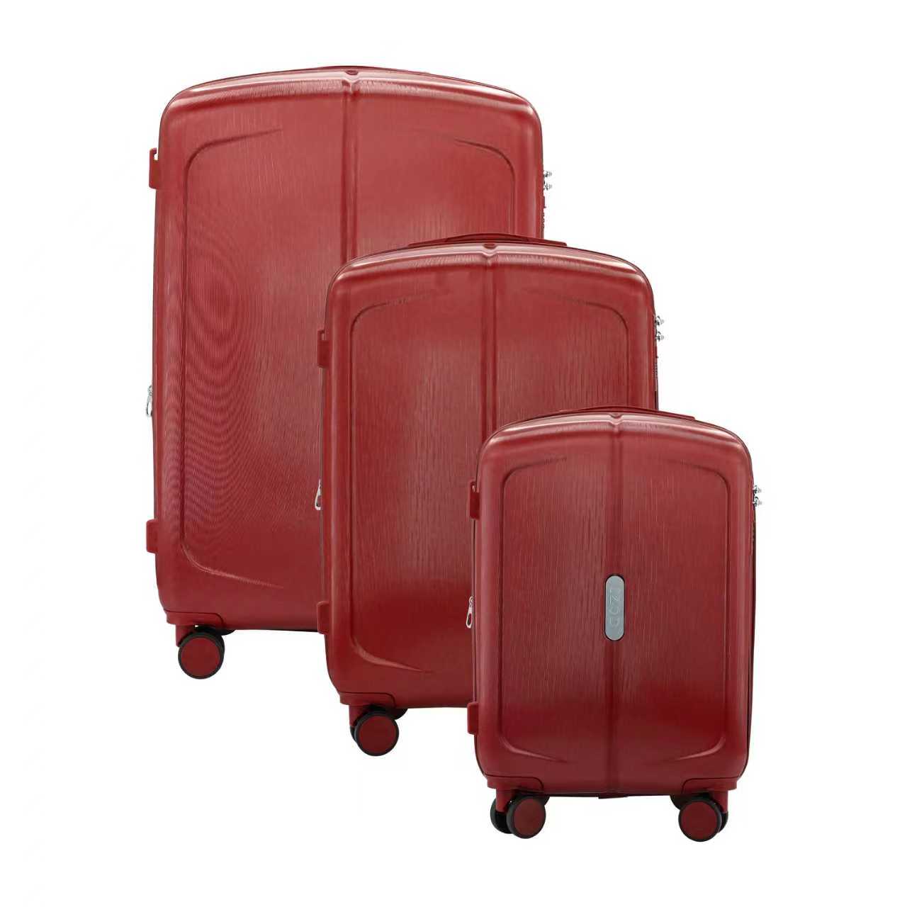 Three red suitcases of different sizes on a white background