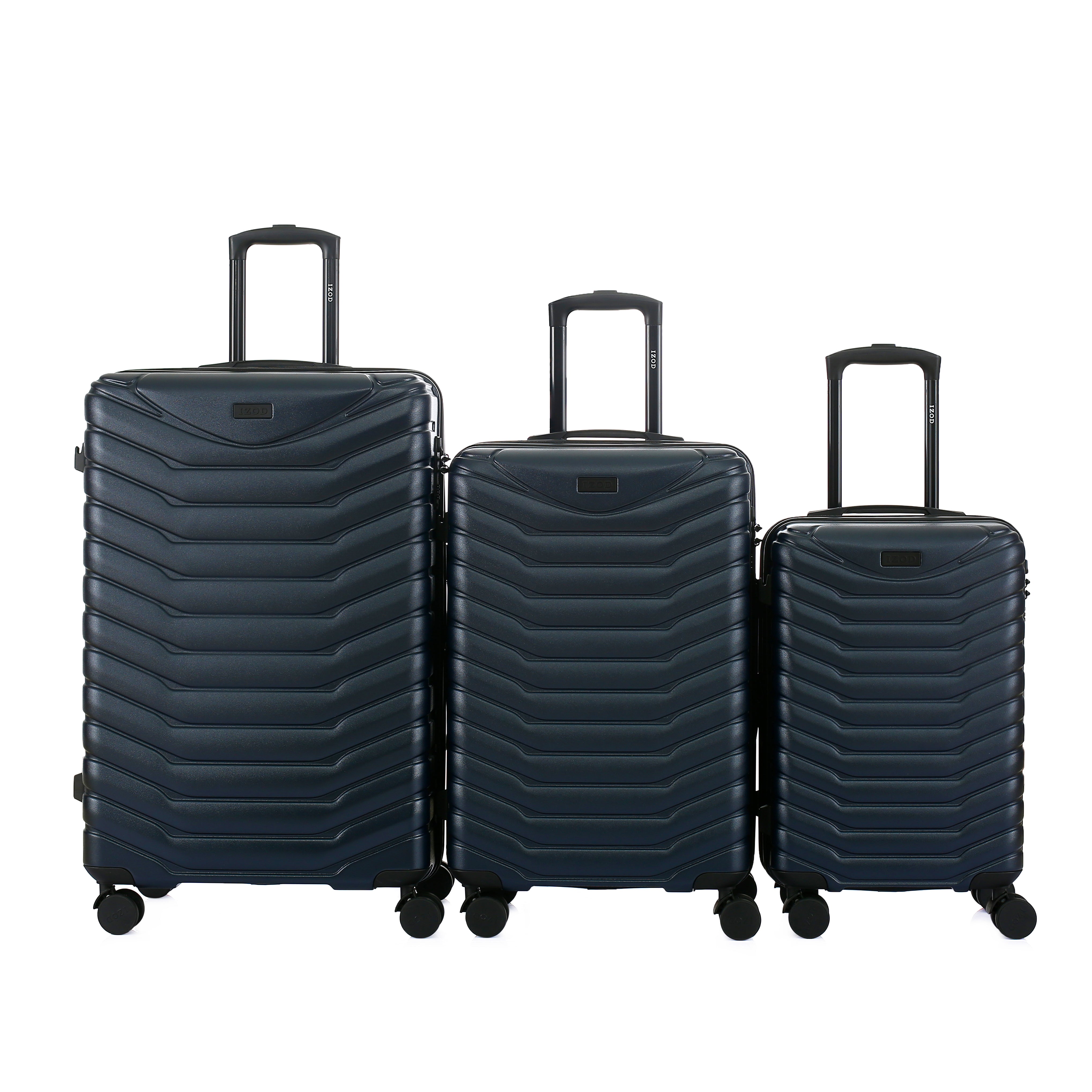 Set of three navy blue suitcases of different sizes on a white background