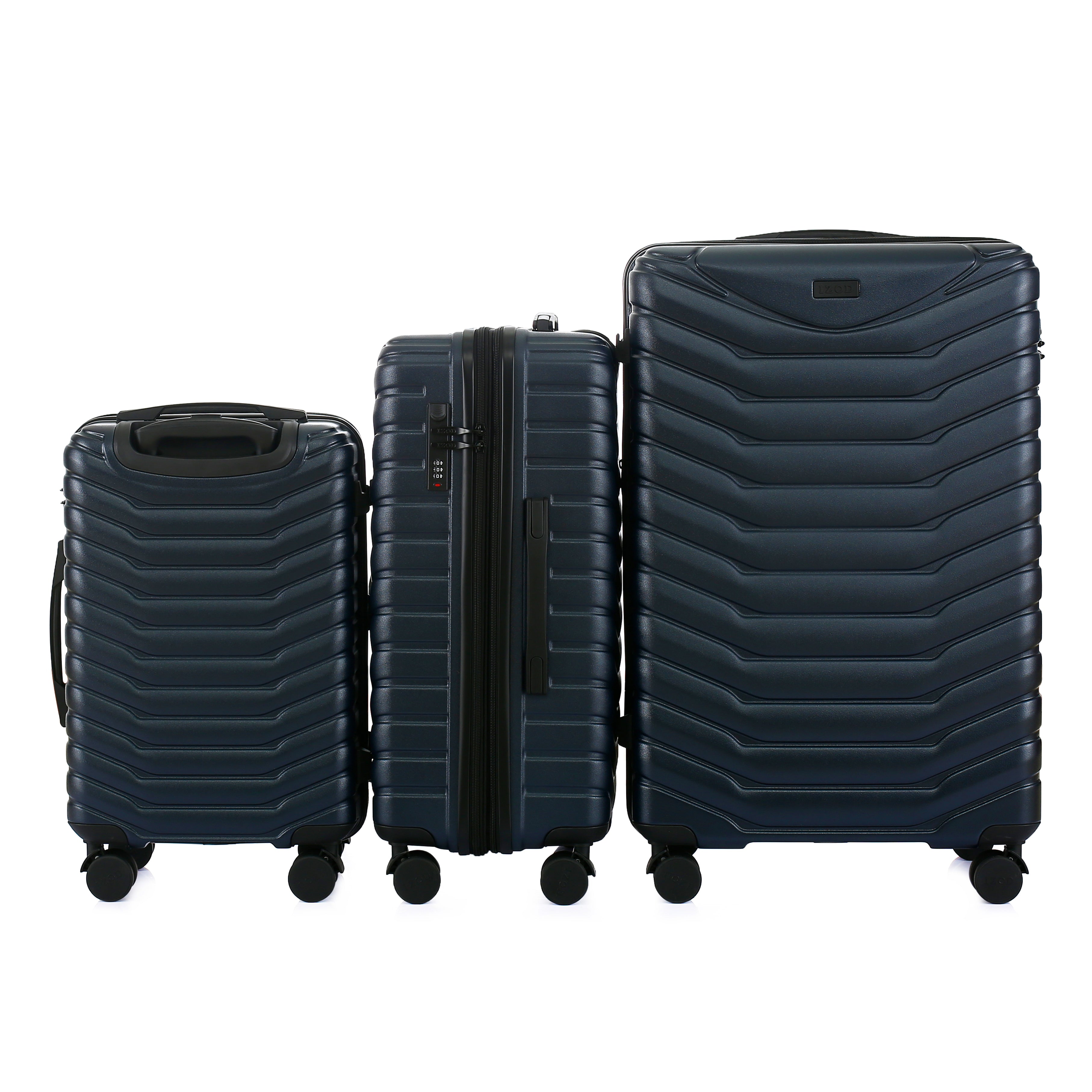 Set of three navy blue suitcases of different sizes on a white background