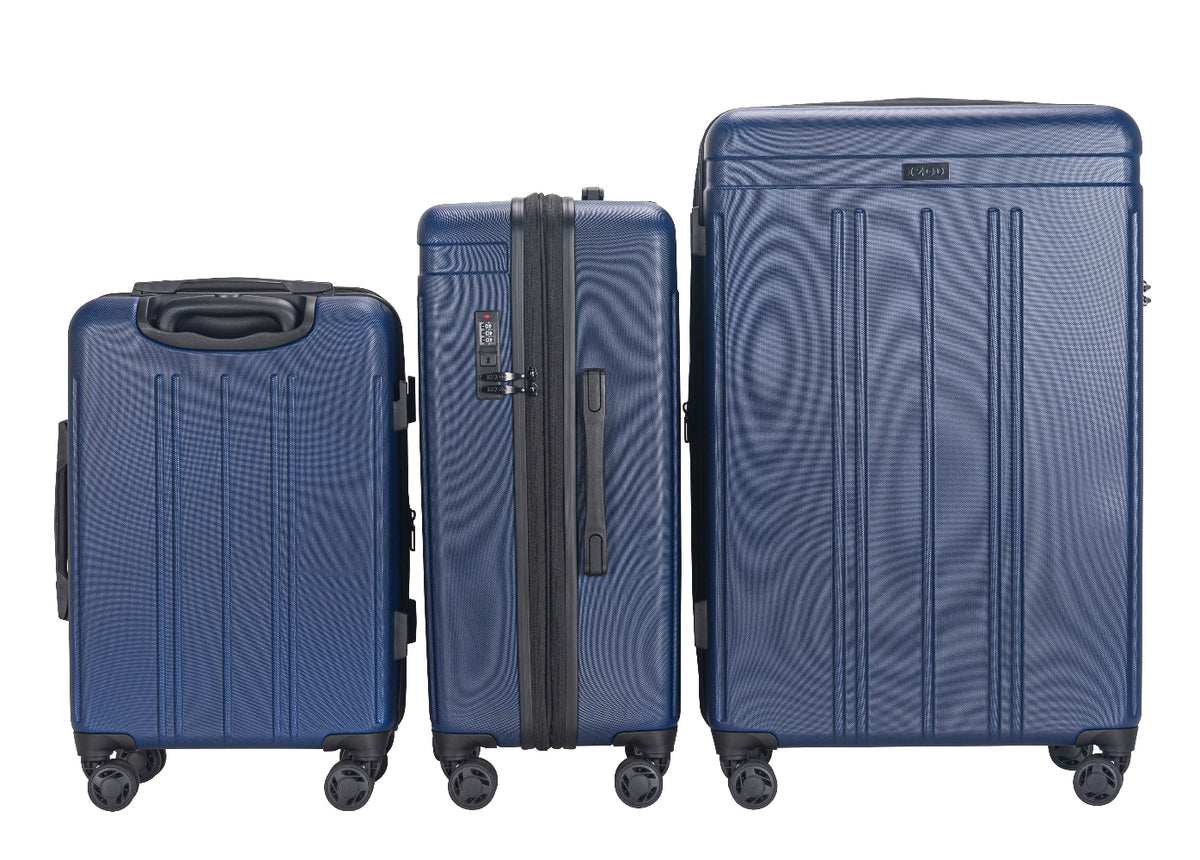 Three blue suitcases of different sizes on a white background
