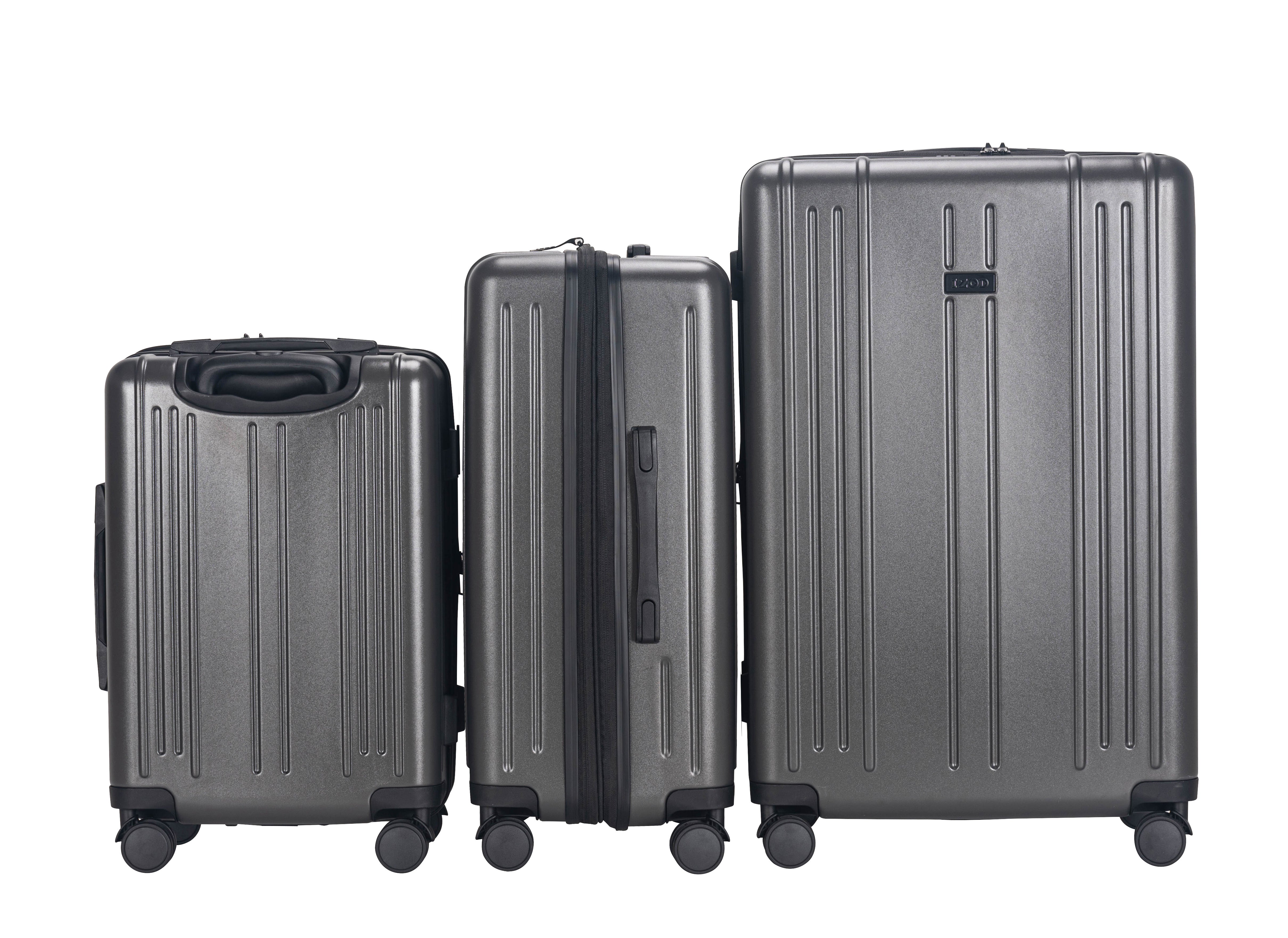 Three gray suitcases of different sizes on a white background
