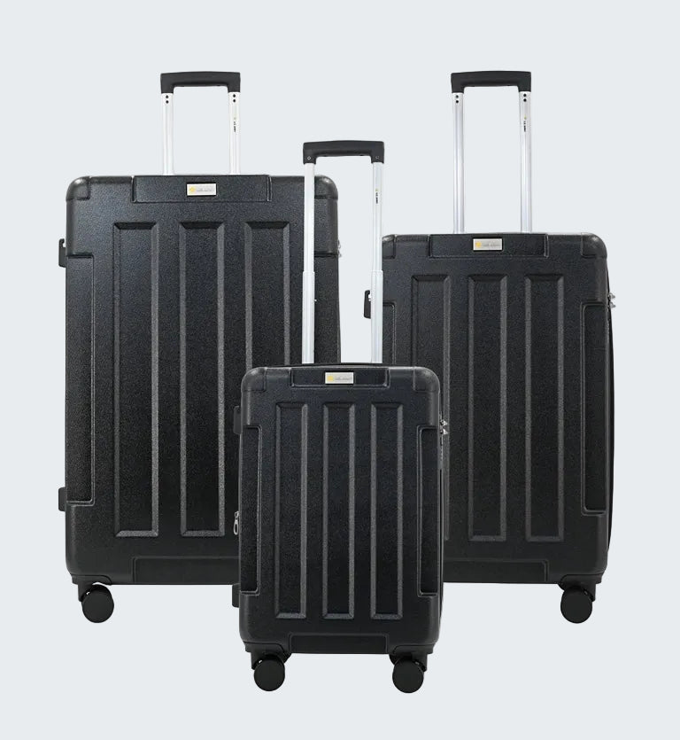 Set of three black suitcases with wheels on a white background