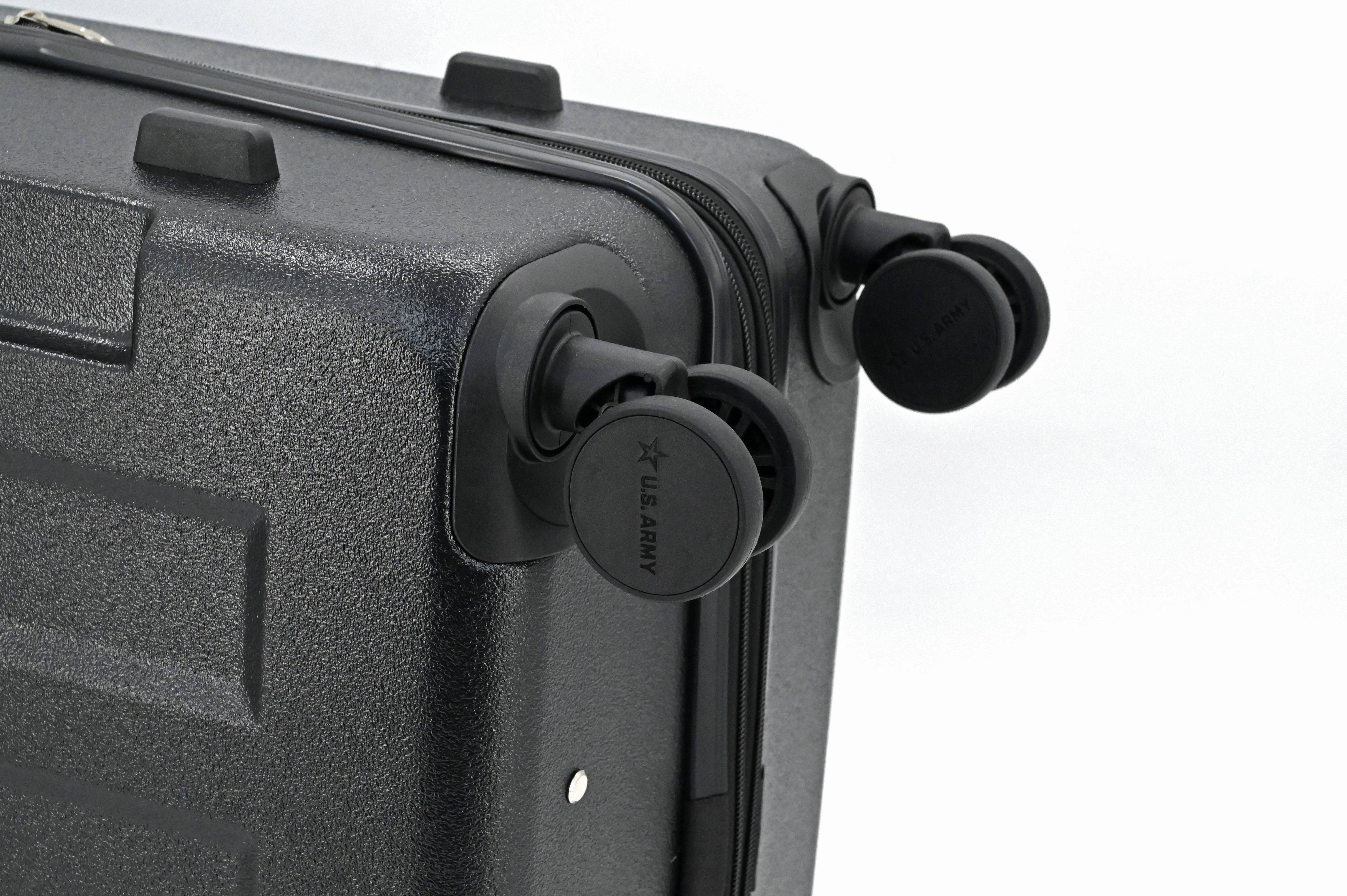 Close-up of a black suitcase handle on a white background
