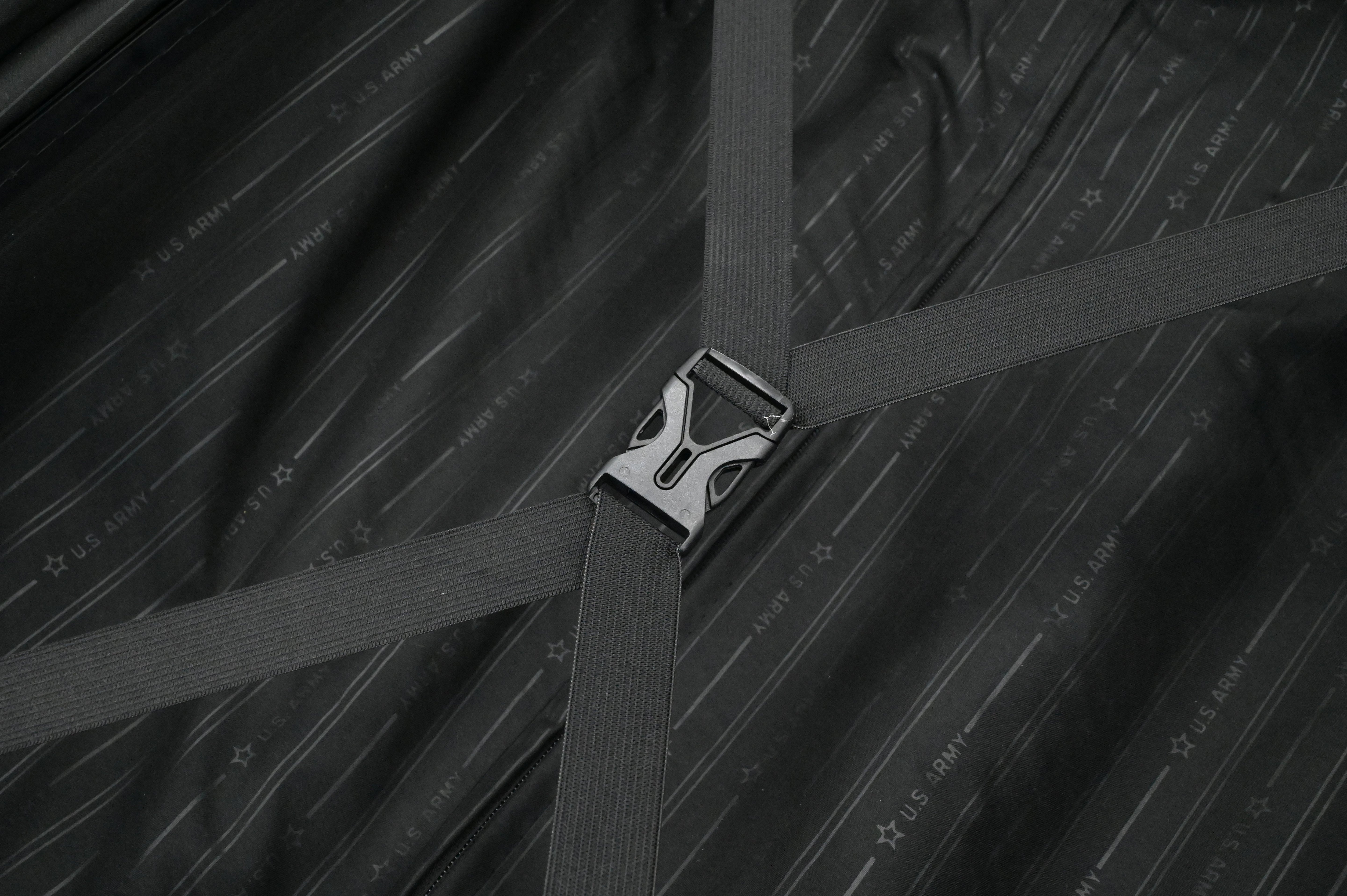 Close-up of a seat belt buckle on a textured black background