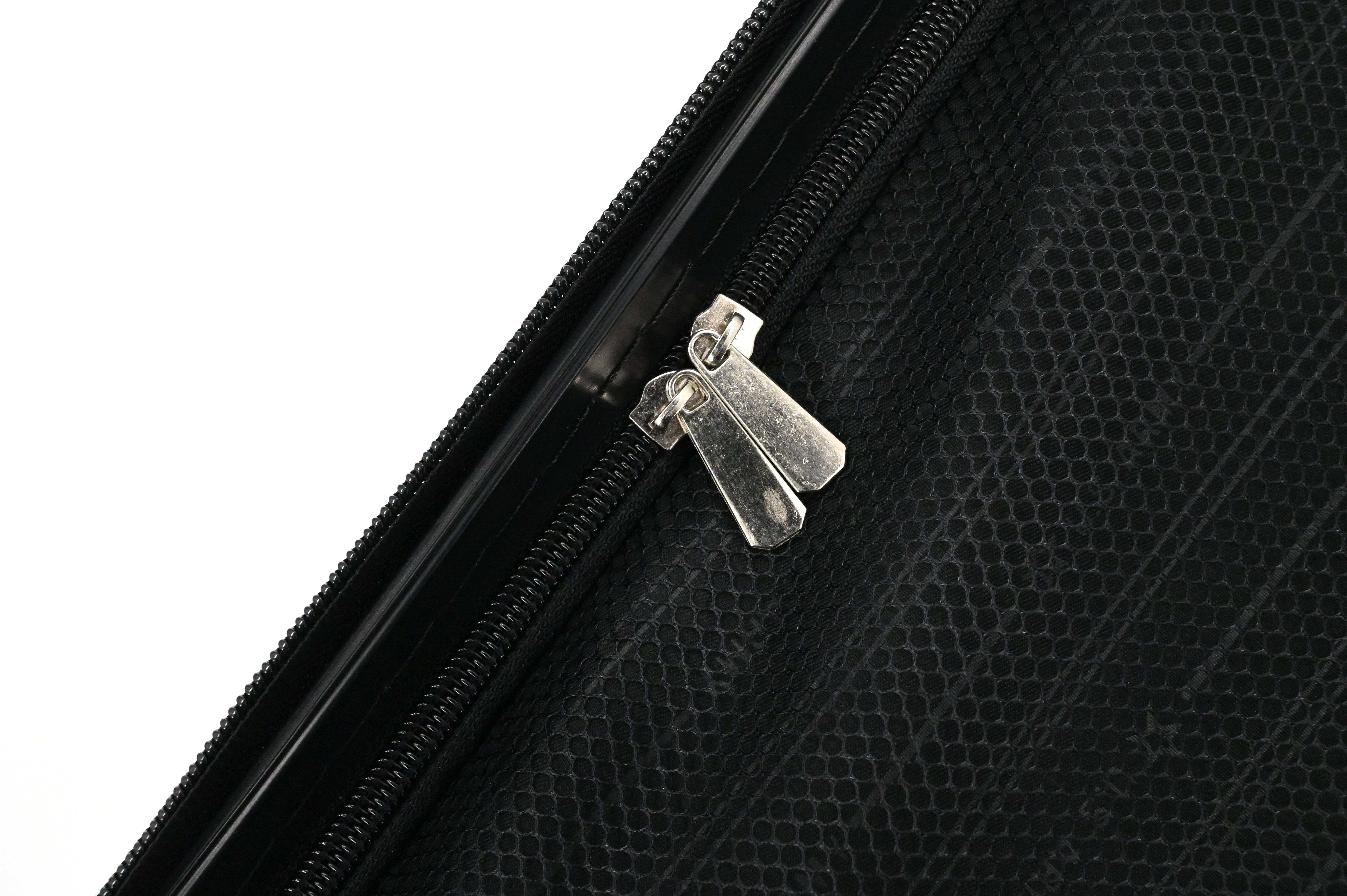 Close-up of a black suitcase with a silver zipper pull on a white background