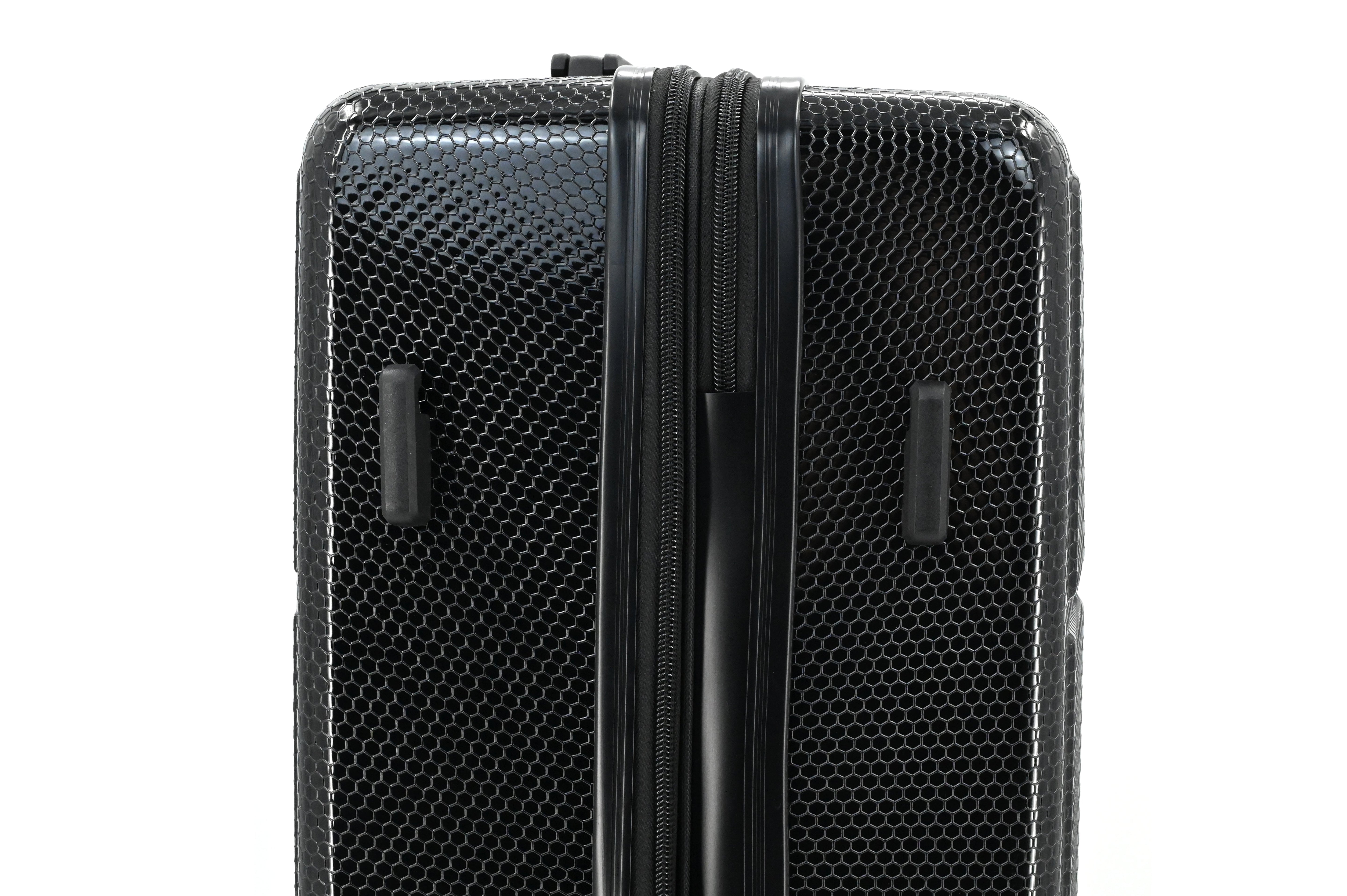 Black textured suitcase with a zipper on a white background