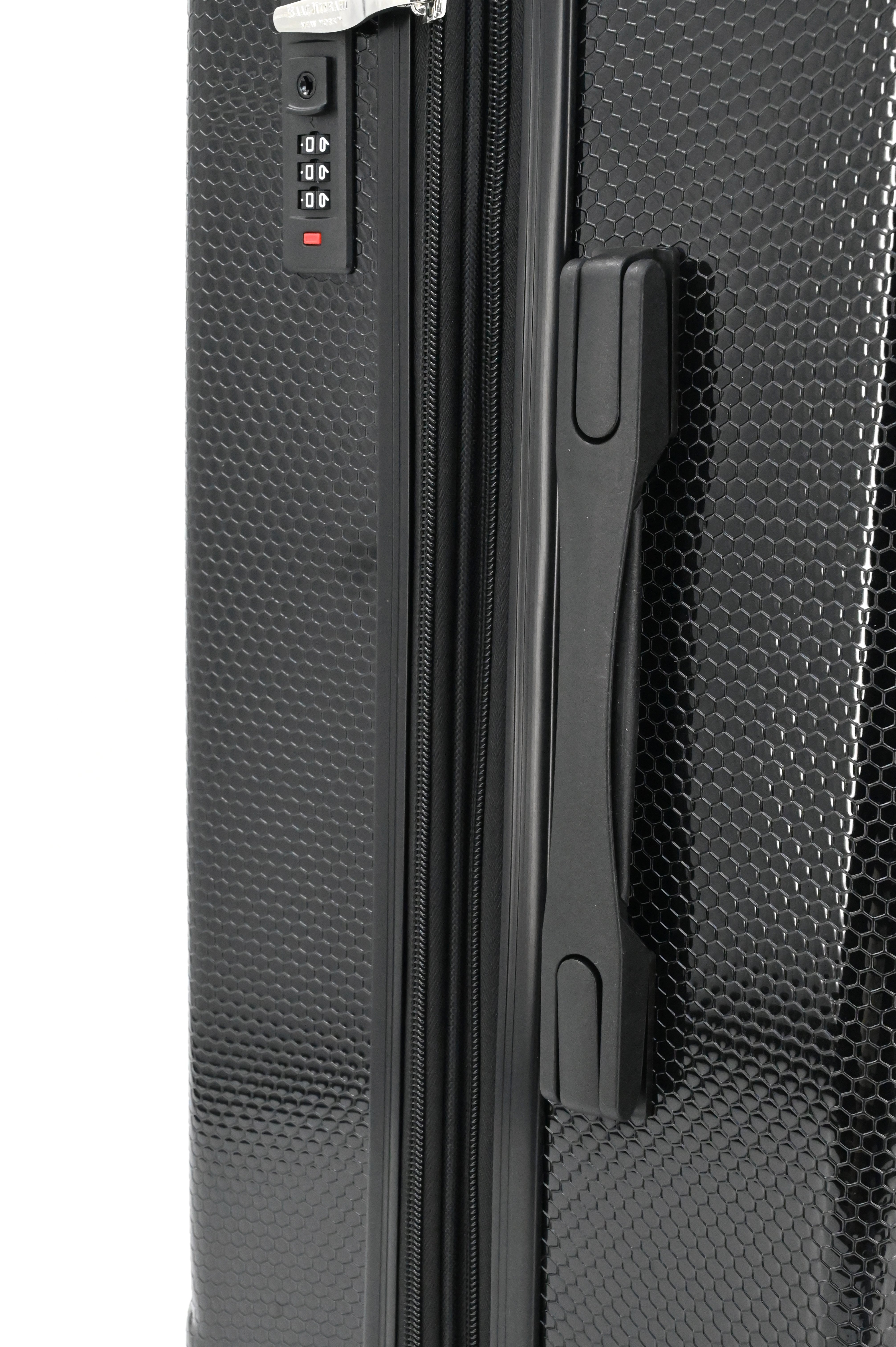 Close-up of a black textured suitcase with a handle and lock mechanism.