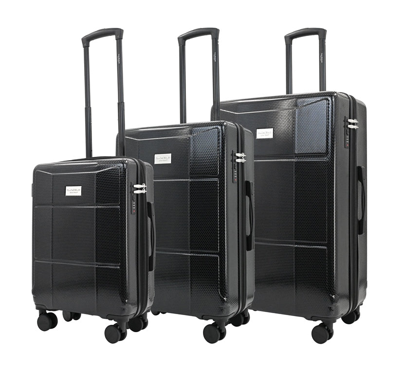 Set of three black suitcases of different sizes on a white background