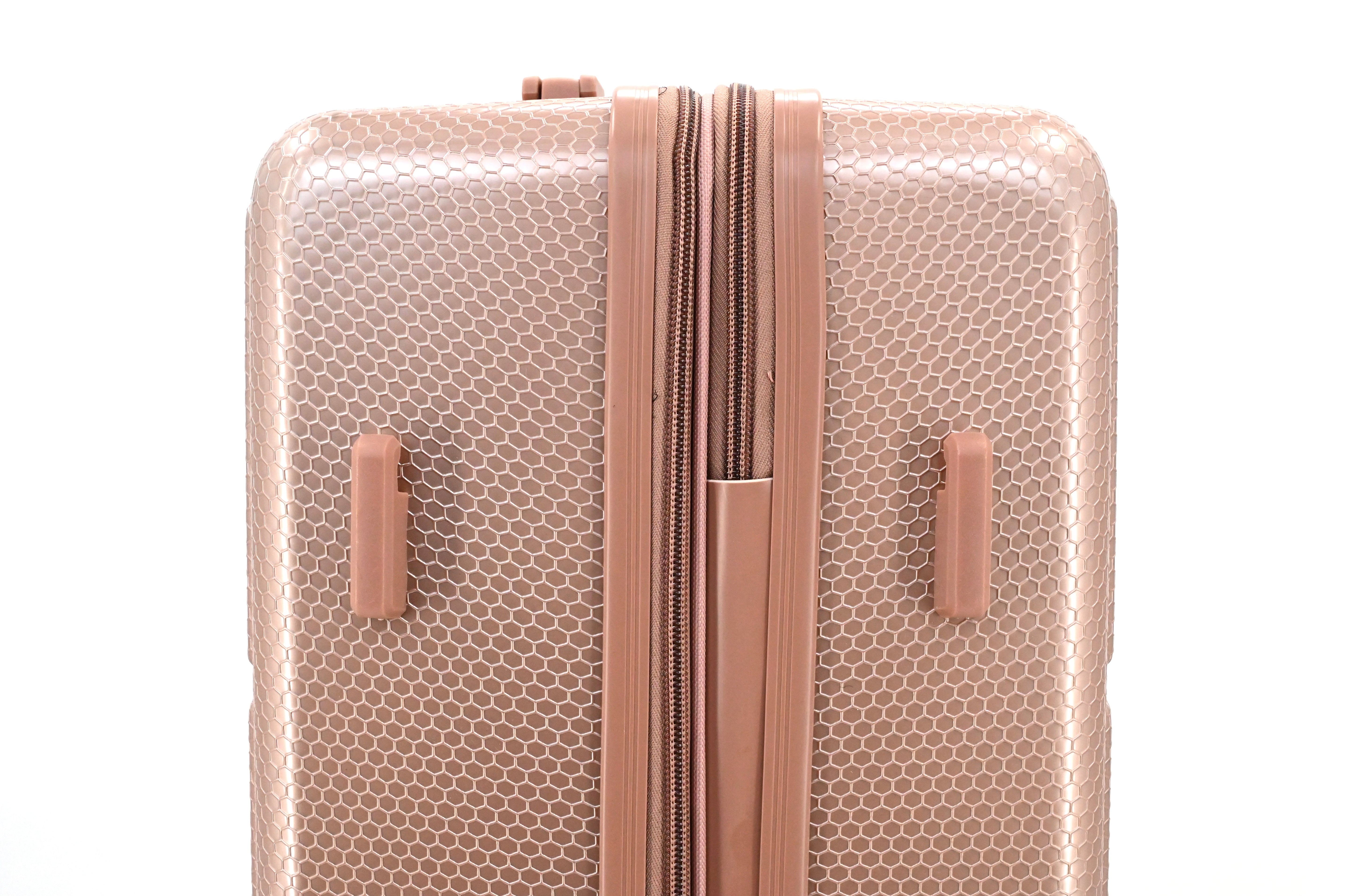 Rose gold textured suitcase with zipper on a white background