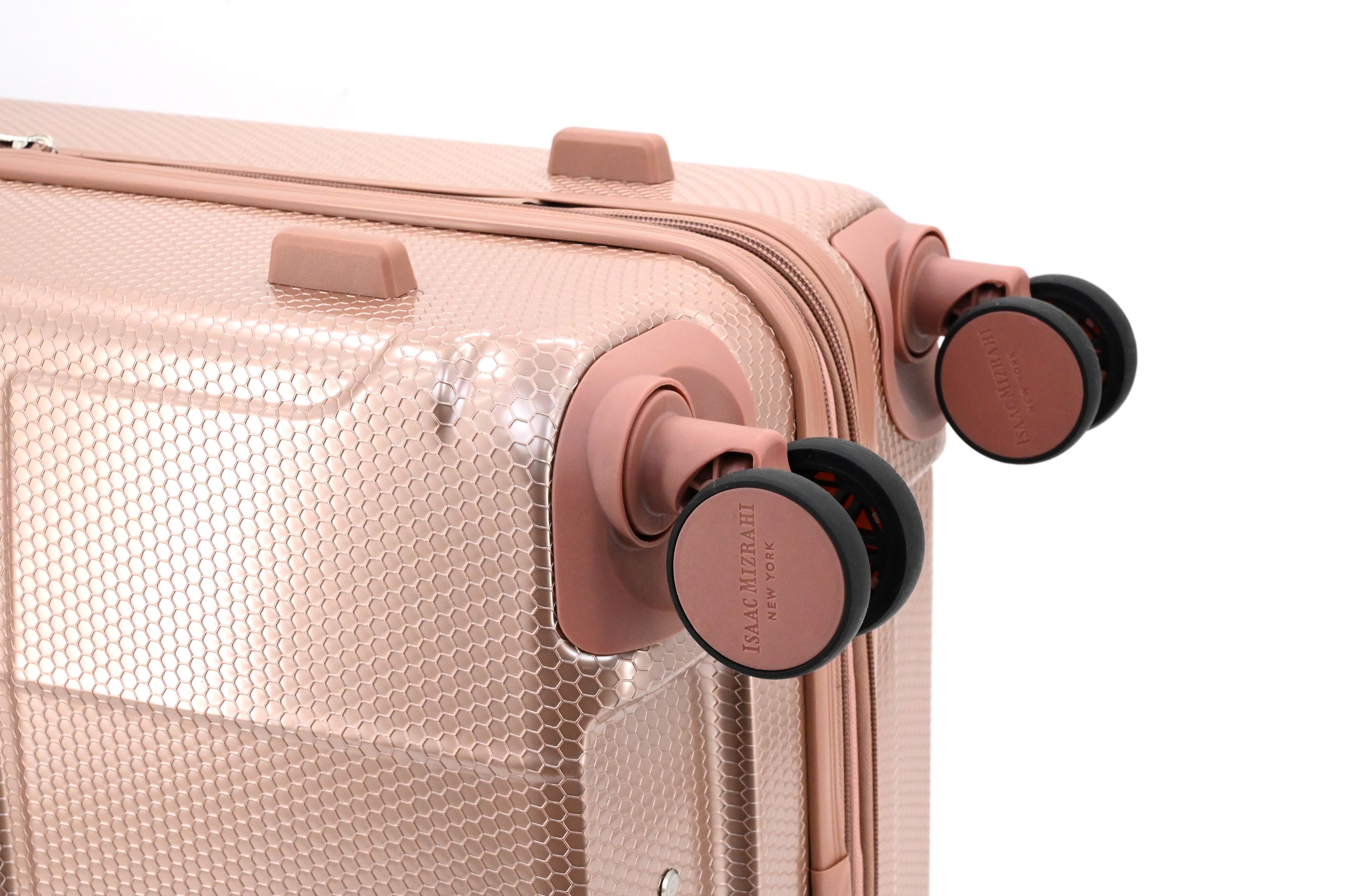 Rose gold suitcase with wheels on a white background