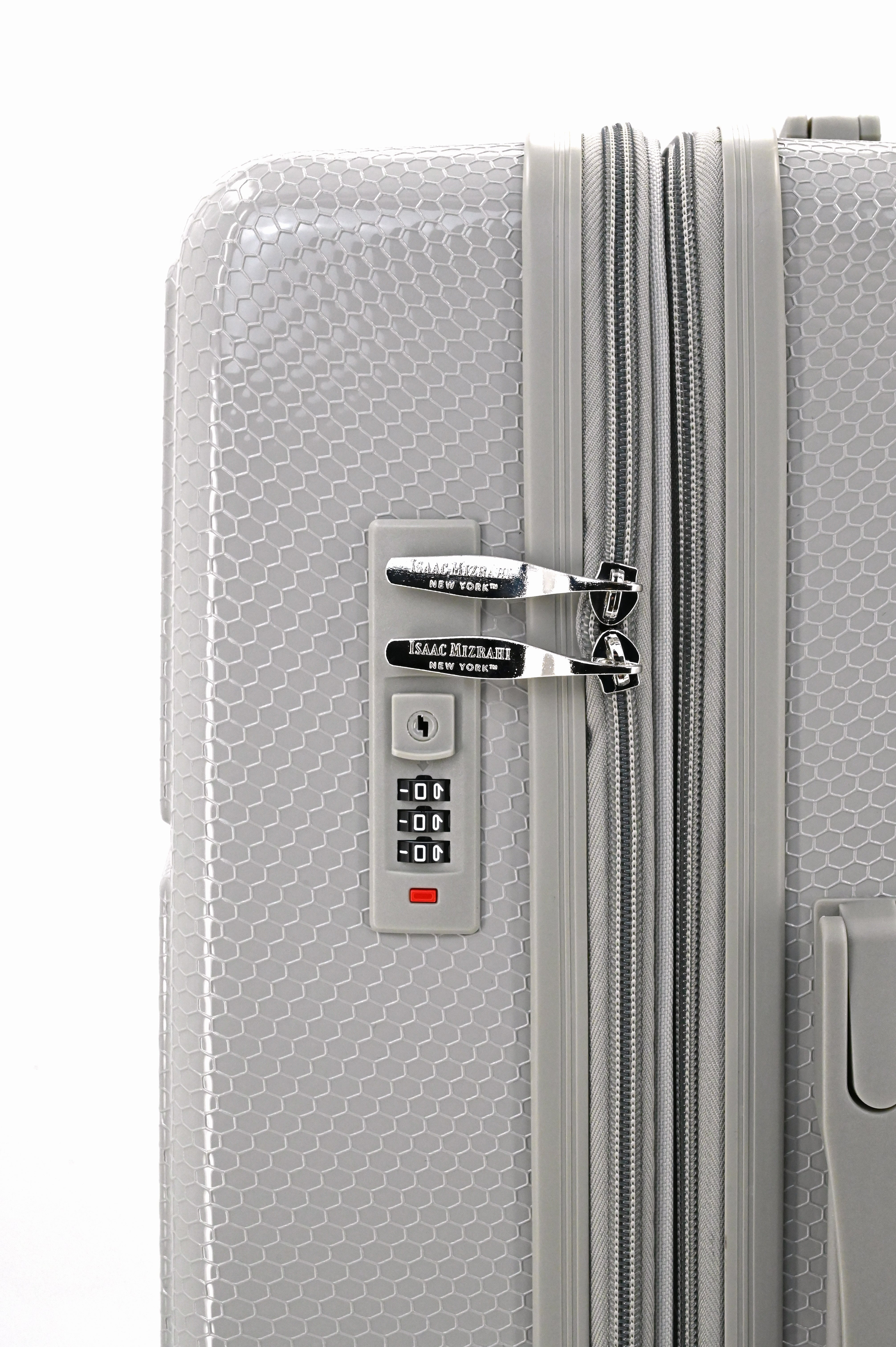 Close-up of a silver suitcase with a combination lock on a white background
