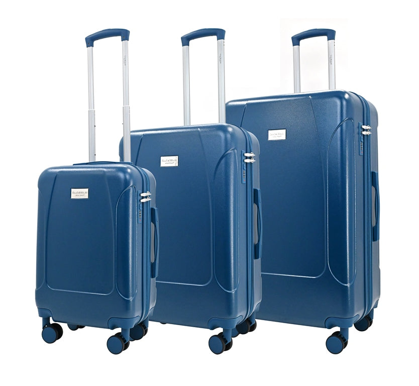 Set of three blue suitcases of different sizes on a white background