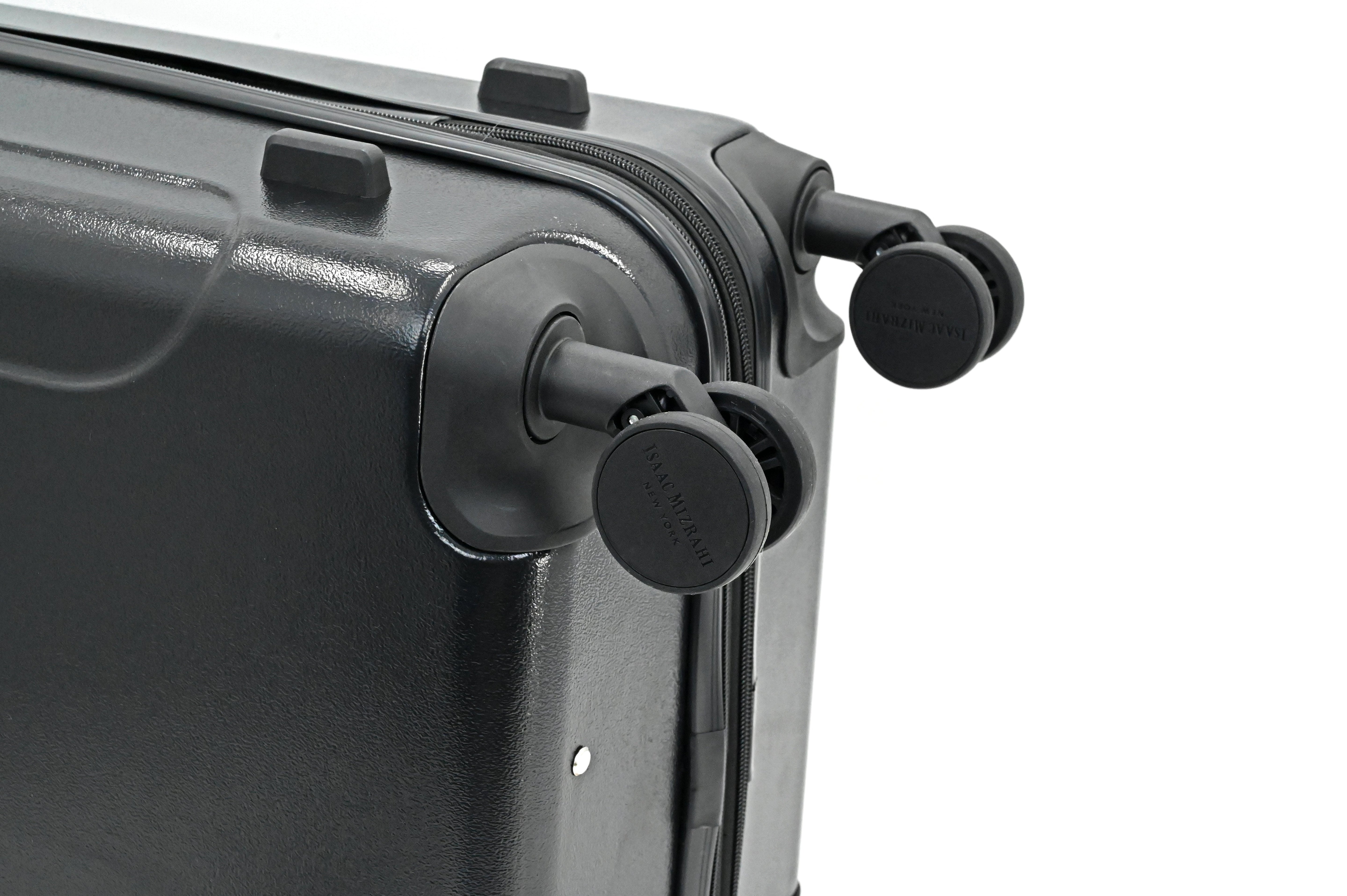Close-up of a black suitcase with wheels on a white background