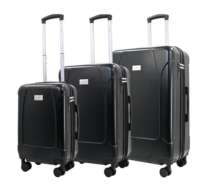 Set of three black suitcases of different sizes on a white background
