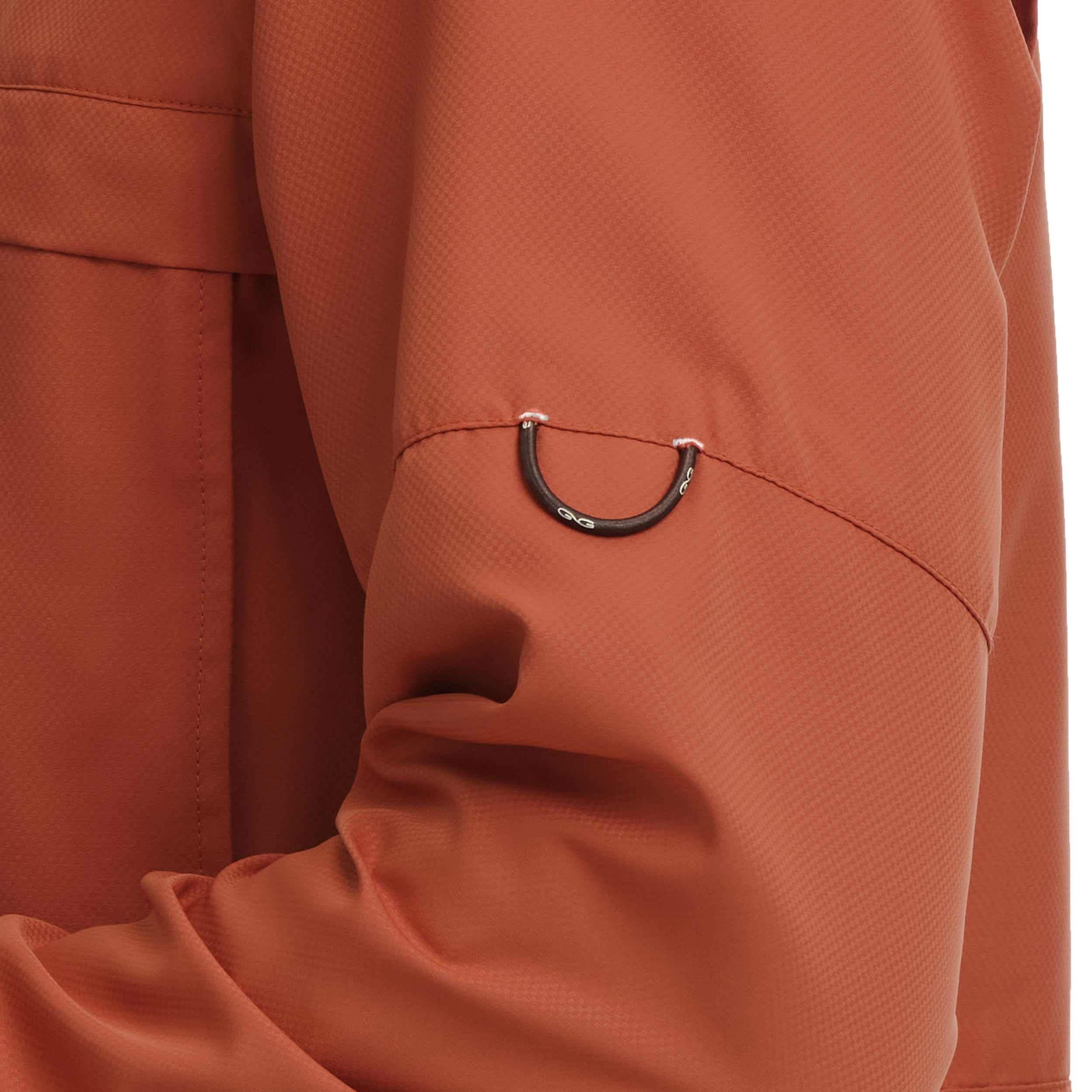 Close-up of a brown jacket with a black zipper pull on a white background