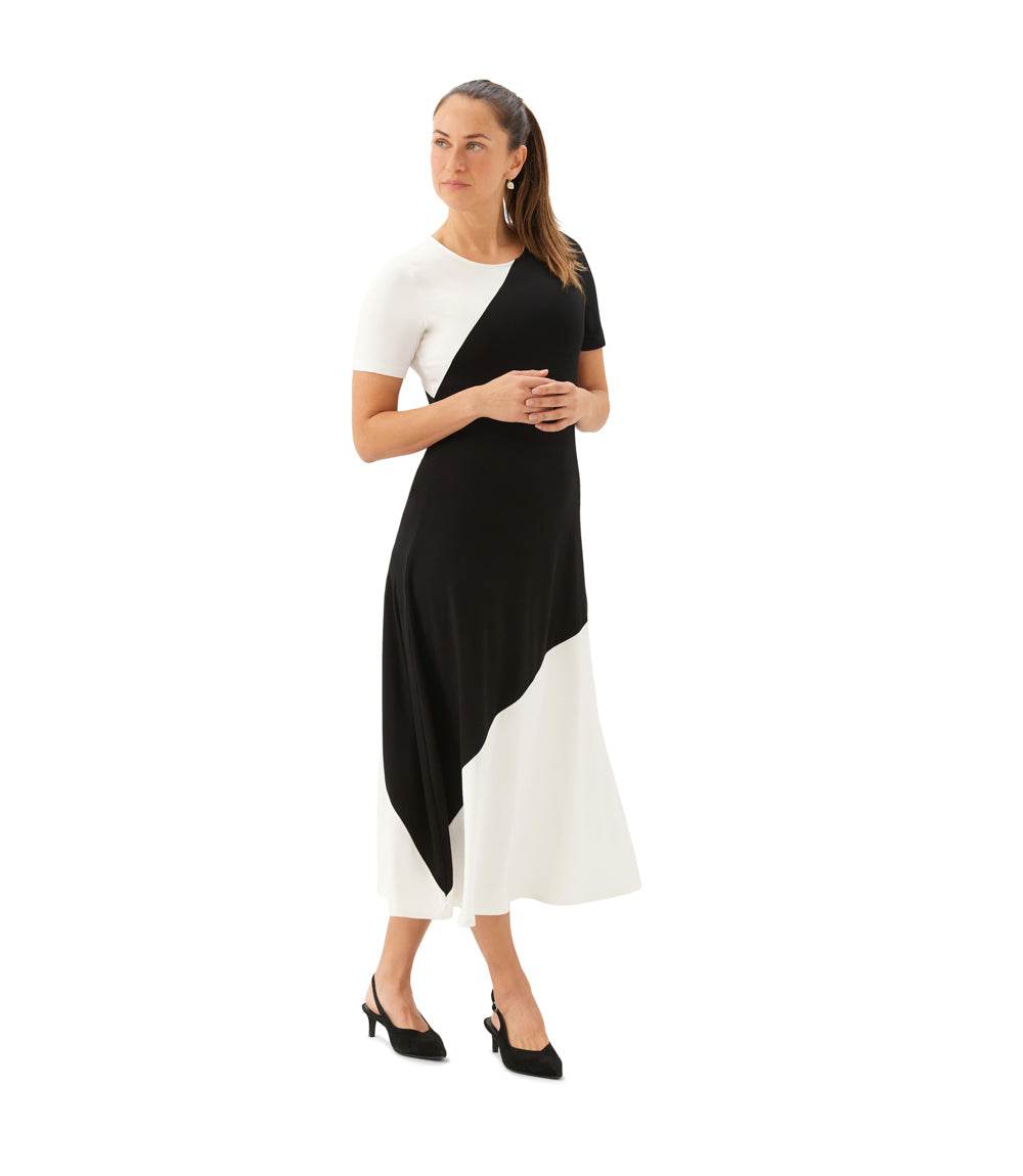 Woman wearing a black and white dress on a white background